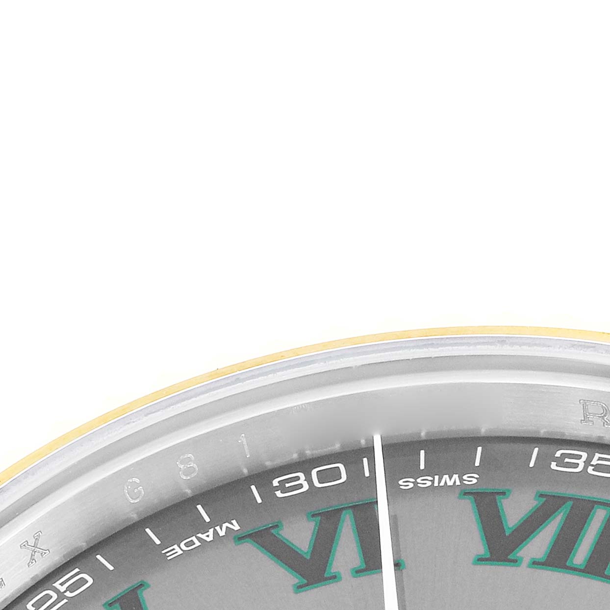 The image shows a close-up of the edge of a Rolex Datejust 116333 Men
s Steel and Gold (two tone) Grey Dial watch face, focusing on Roman numerals, indices, and part of the bezel.
