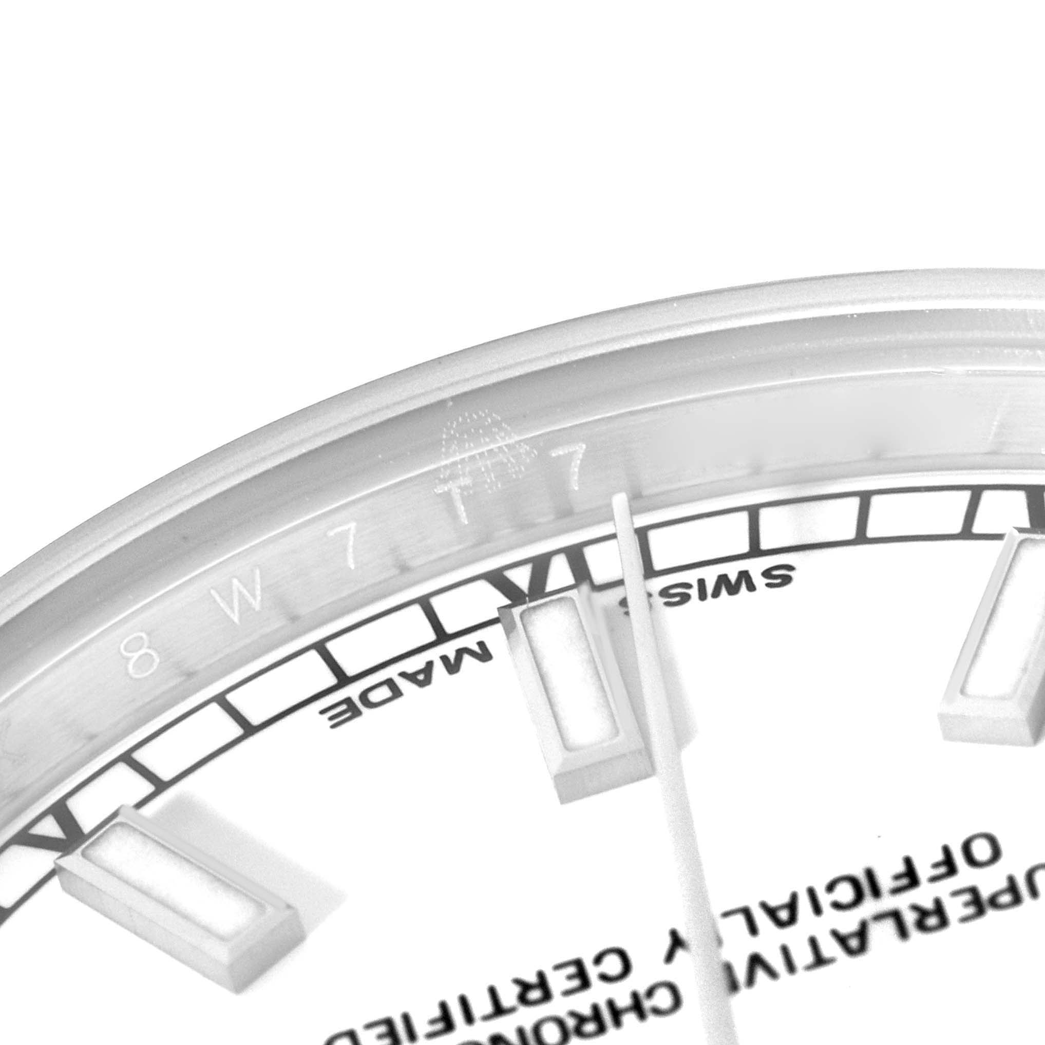 This image shows a close-up of the dial and hour markers of a Mid-Size Rolex watch.