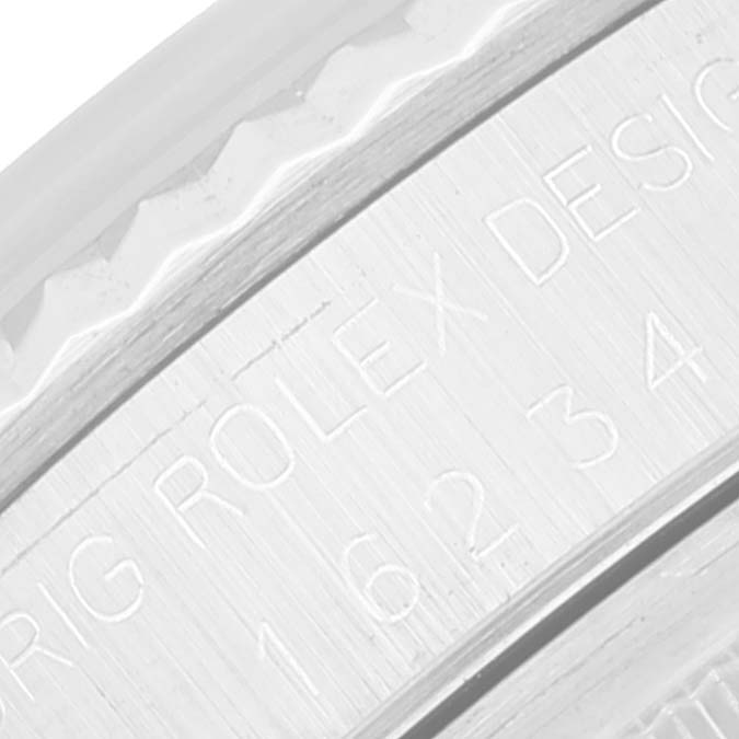This image shows a close-up of the engraved text on the side of a Rolex Datejust 16234 Men's Stainless Steel Silver Dial 16234 Men's Stainless Steel Silver Dial watch case.