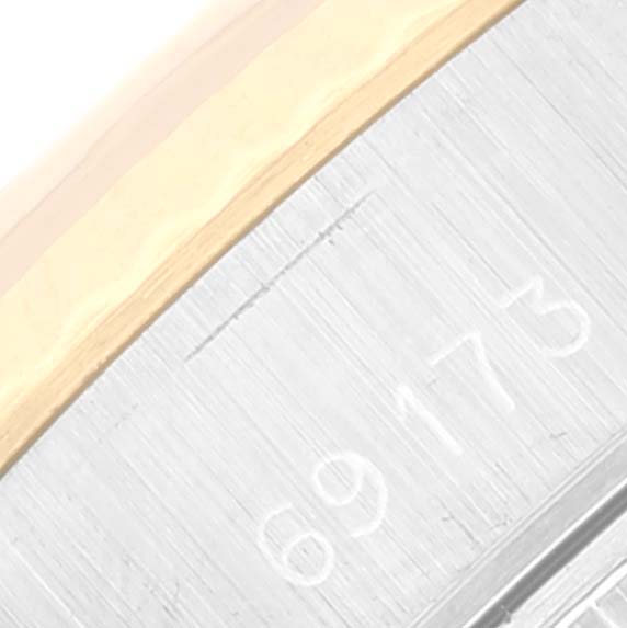 This close-up image shows part of the metal band with the model number "69173" on a Rolex Datejust 69173 Women's Steel and Gold (two tone) Champagne Dial 69173 Women's Steel and Gold (two tone) Champagne Dial watch.