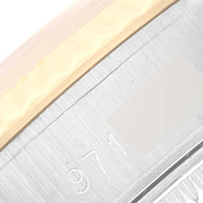 This image shows a close-up of the bezel and part of the engraved inner rim of a Rolex Datejust 69173 Women's Steel and Gold (two tone) Champagne Dial 69173 Women's Steel and Gold (two tone) Champagne Dial watch.