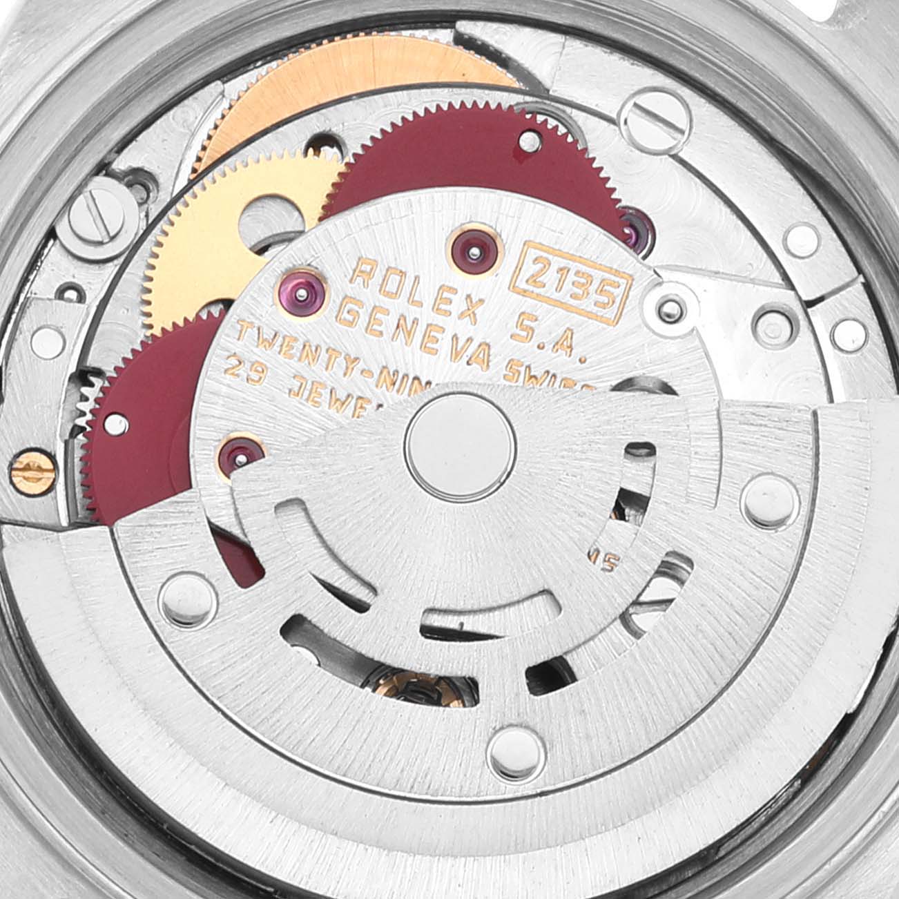 This image shows the internal mechanism and movement of a Rolex Datejust 69173 Women's Steel and Gold (two tone) Champagne Dial 69173 Women's Steel and Gold (two tone) Champagne Dial watch, highlighting the gears and engravings.