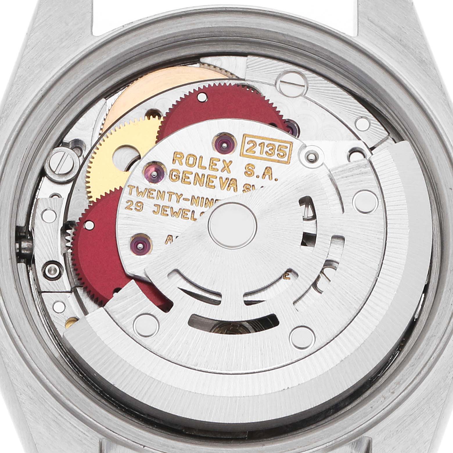 The image shows the movement of a Rolex Datejust 69173 Women
s Steel and Gold (two tone) Silver Dial, viewed from the back, displaying gears and components.