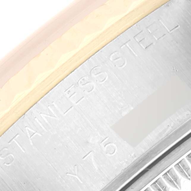 This close-up angle shows the stainless steel and engraving on the side of the Rolex Datejust 79173 Women's Steel and Gold (two tone) Champagne Dial 79173 Women's Steel and Gold (two tone) Champagne Dial watch case.