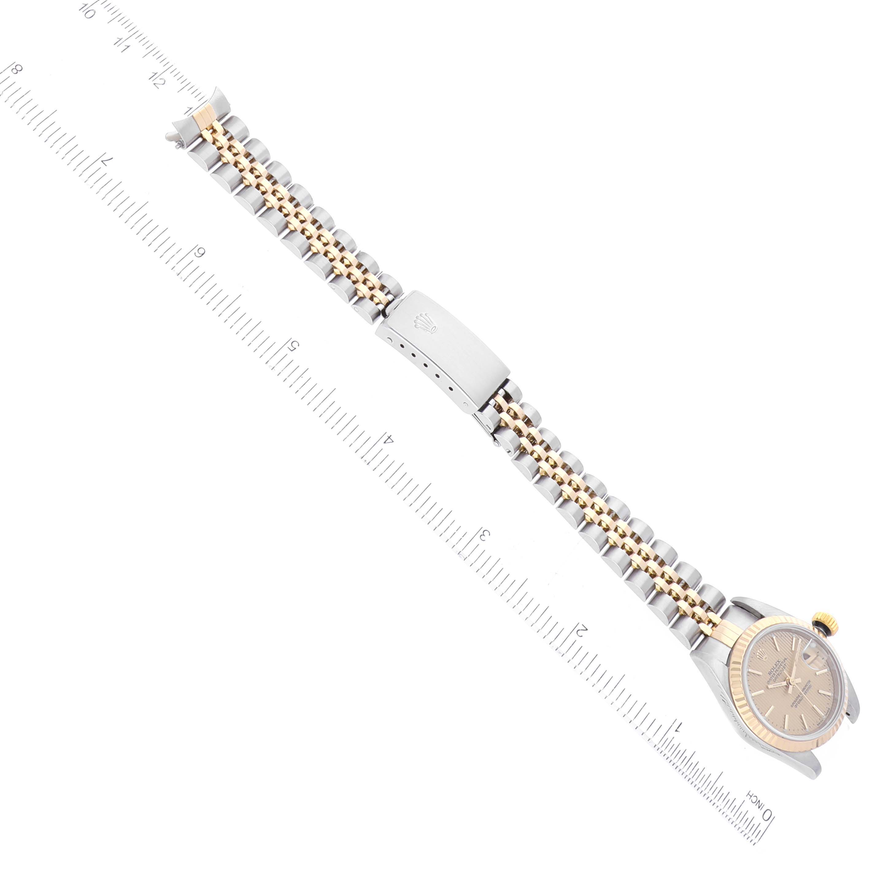 The image shows a Rolex Datejust 79173 Women's Steel and Gold (two tone) Champagne Dial 79173 Women's Steel and Gold (two tone) Champagne Dial watch bracelet and clasp from a top-down angle, alongside a measuring ruler.