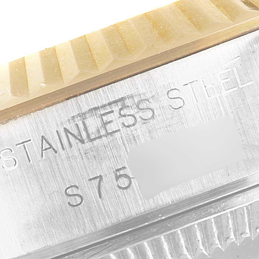 The image shows a close-up of the bezel and case side of a Rolex Datejust 69173 Women's Steel and Gold (two tone) White Dial 69173 Women's Steel and Gold (two tone) White Dial watch, with "STAINLESS STEEL" engraving.