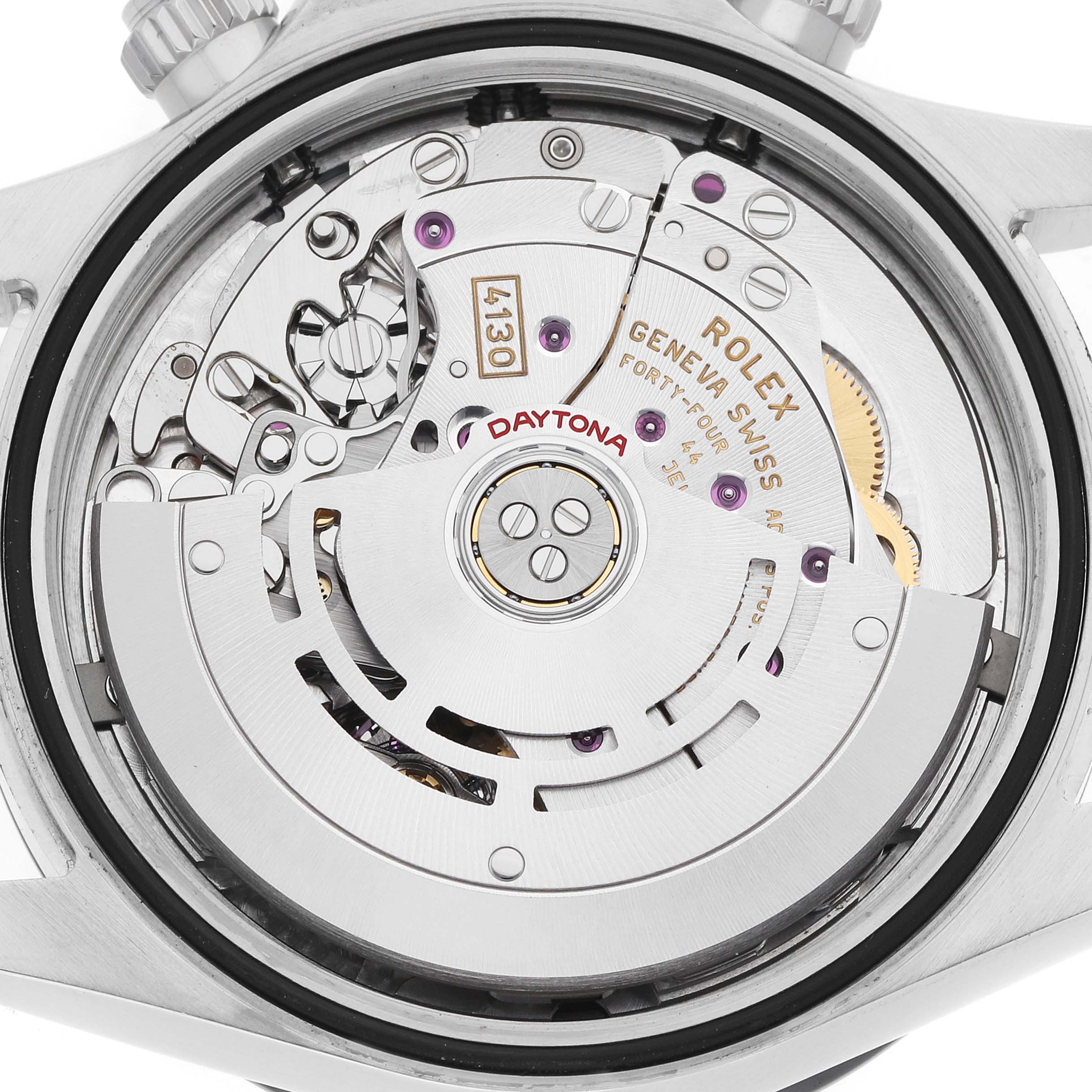 The image shows the movement of a Rolex Daytona 116500 Men
s Stainless Steel Black Dial watch from the back view, featuring its intricate components and rotor.