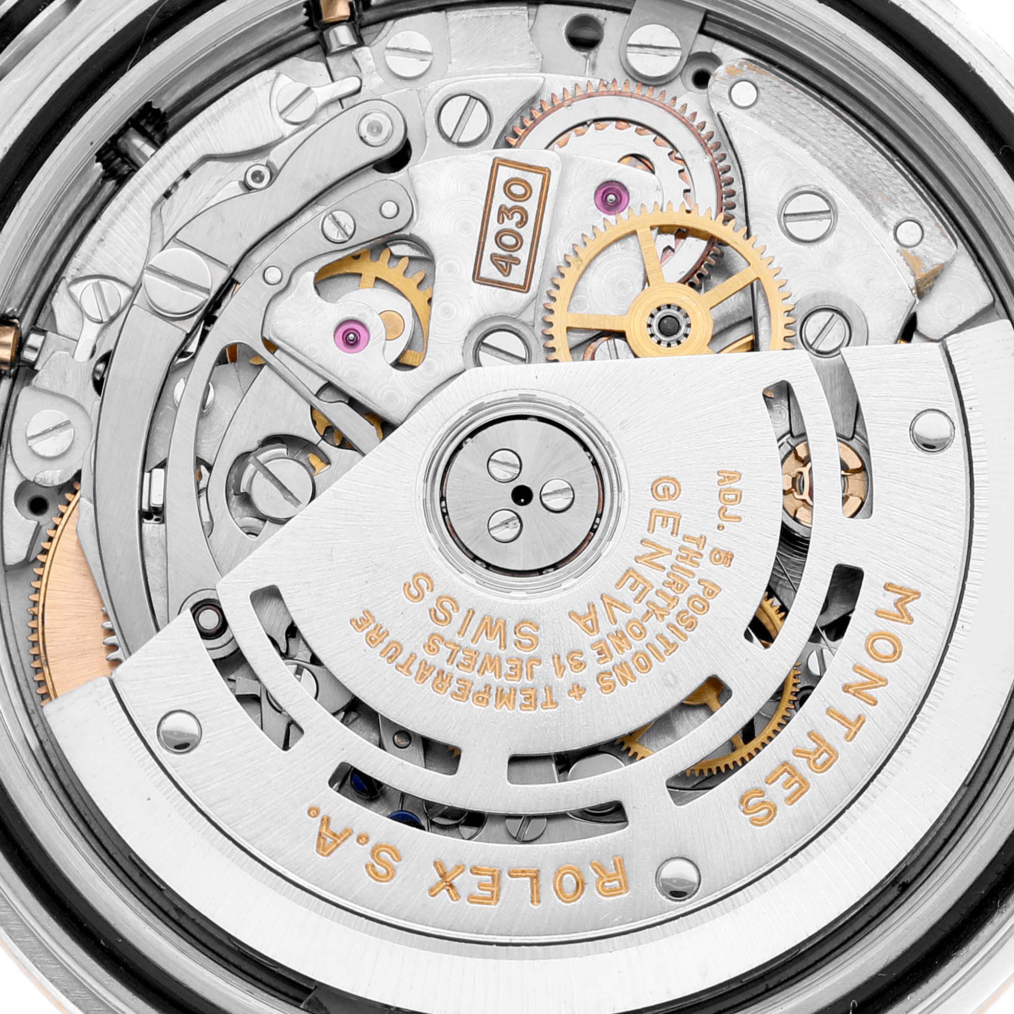 This image shows the intricate internal mechanism of the Rolex Daytona 16523 Men's Steel and Gold (two tone) White Dial 16523 Men's Steel and Gold (two tone) White Dial watch from a close-up angle.