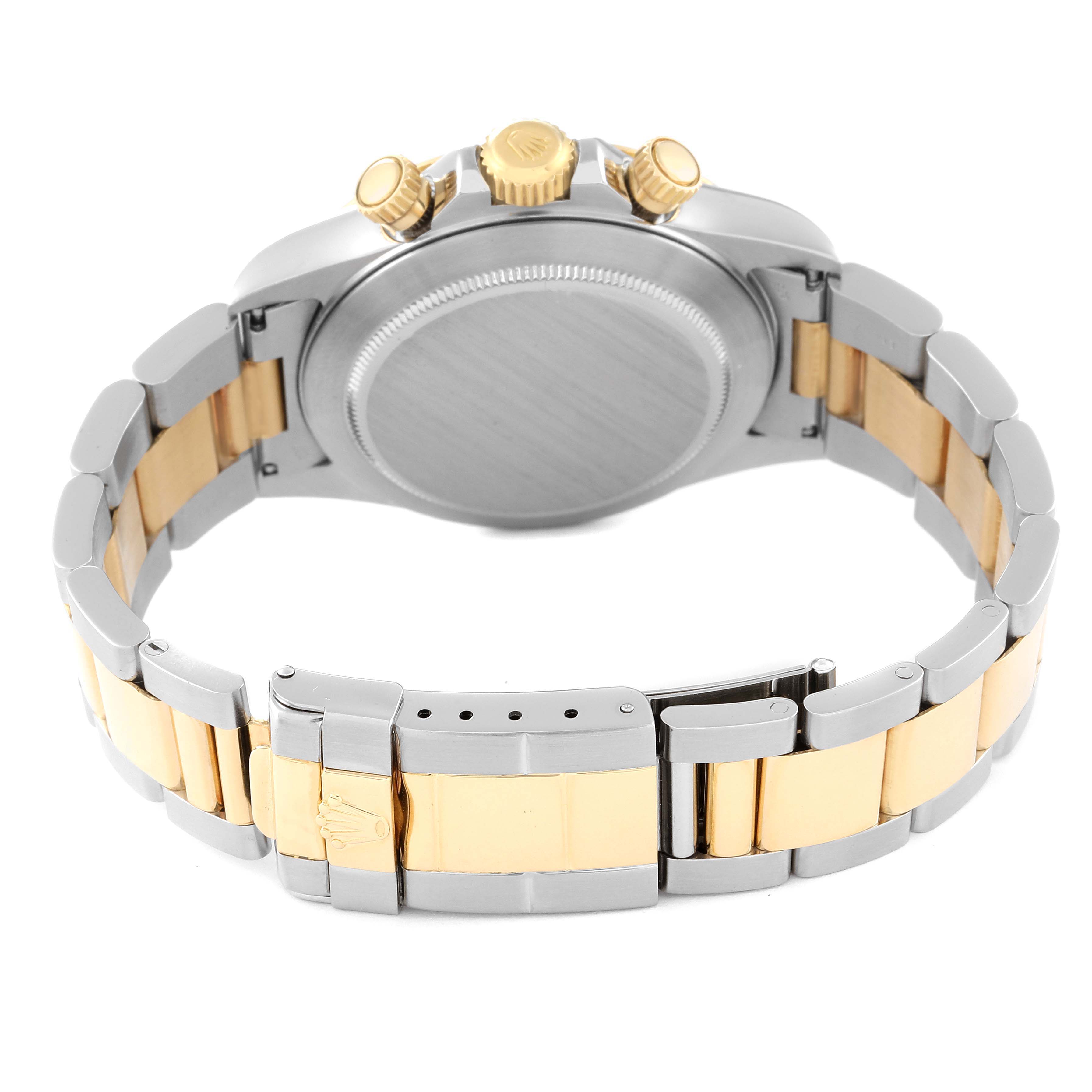 The image shows the back-case and part of the bracelet of a Rolex Daytona 16523 Men's Steel and Gold (two tone) White Dial 16523 Men's Steel and Gold (two tone) White Dial watch from a rear angle.