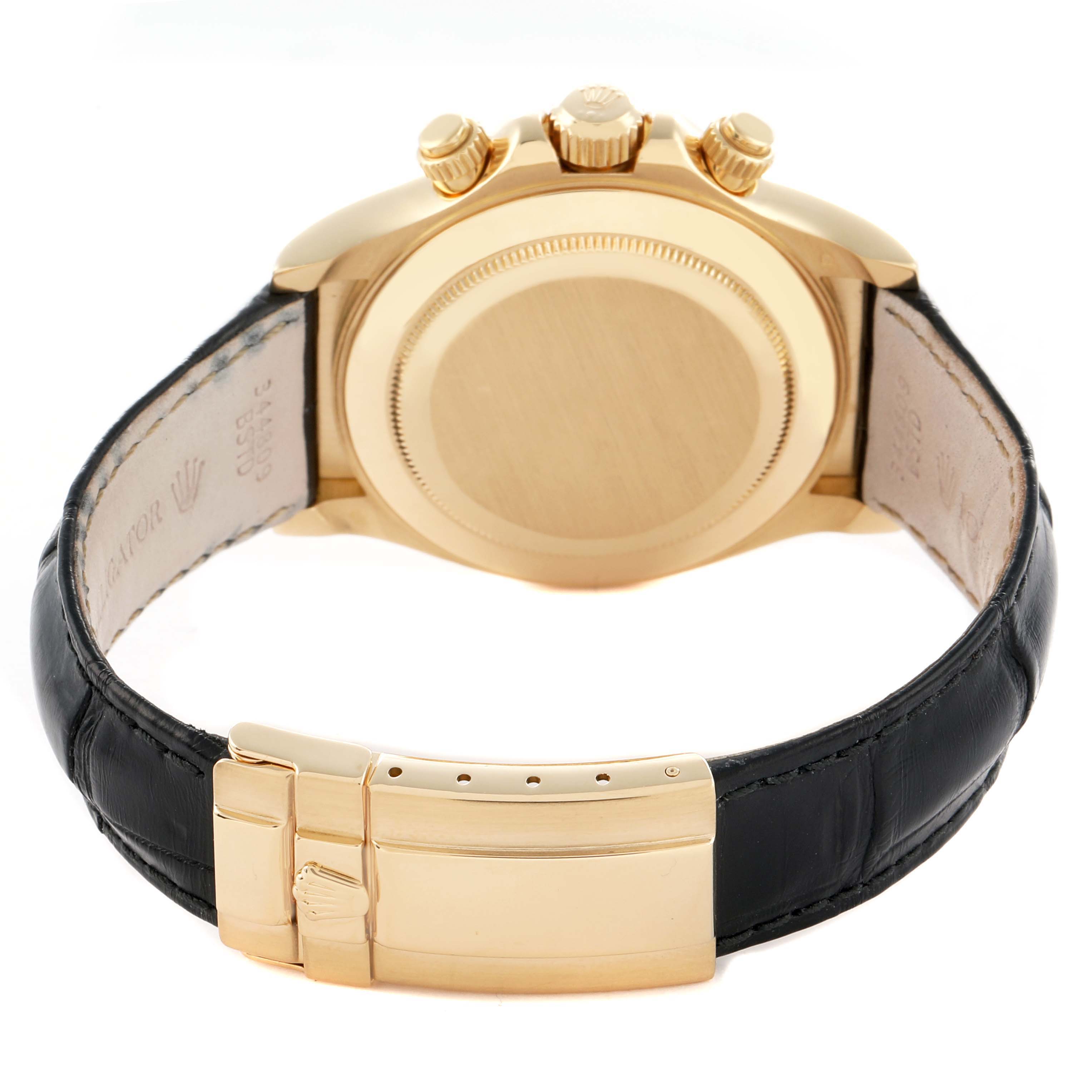 The image shows the back view of a Rolex Daytona 116518 Men
s Yellow Gold Black Dial watch with a gold case and black leather strap.
