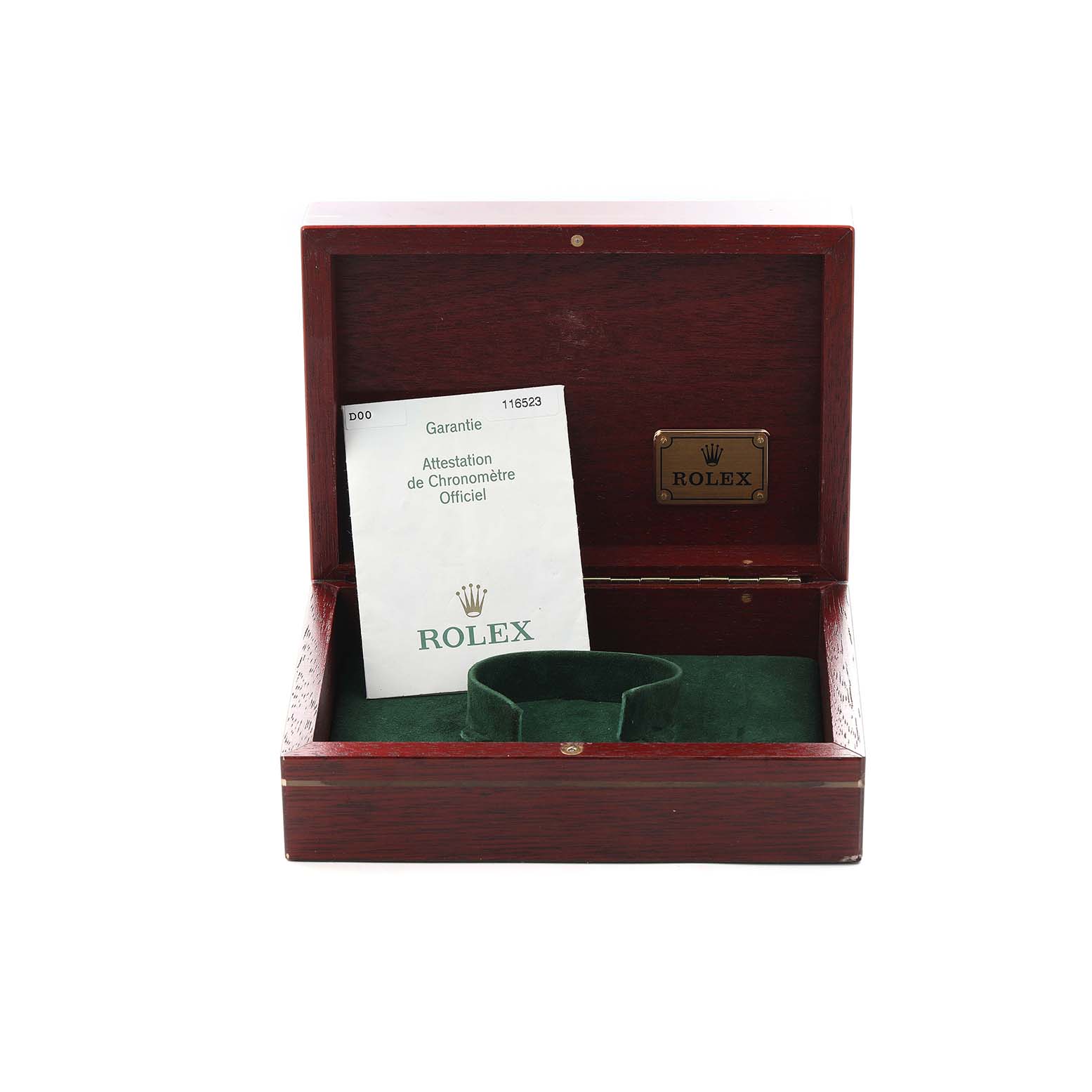 The image shows an open Rolex box for the Daytona model, with paperwork and a green watch holder inside.