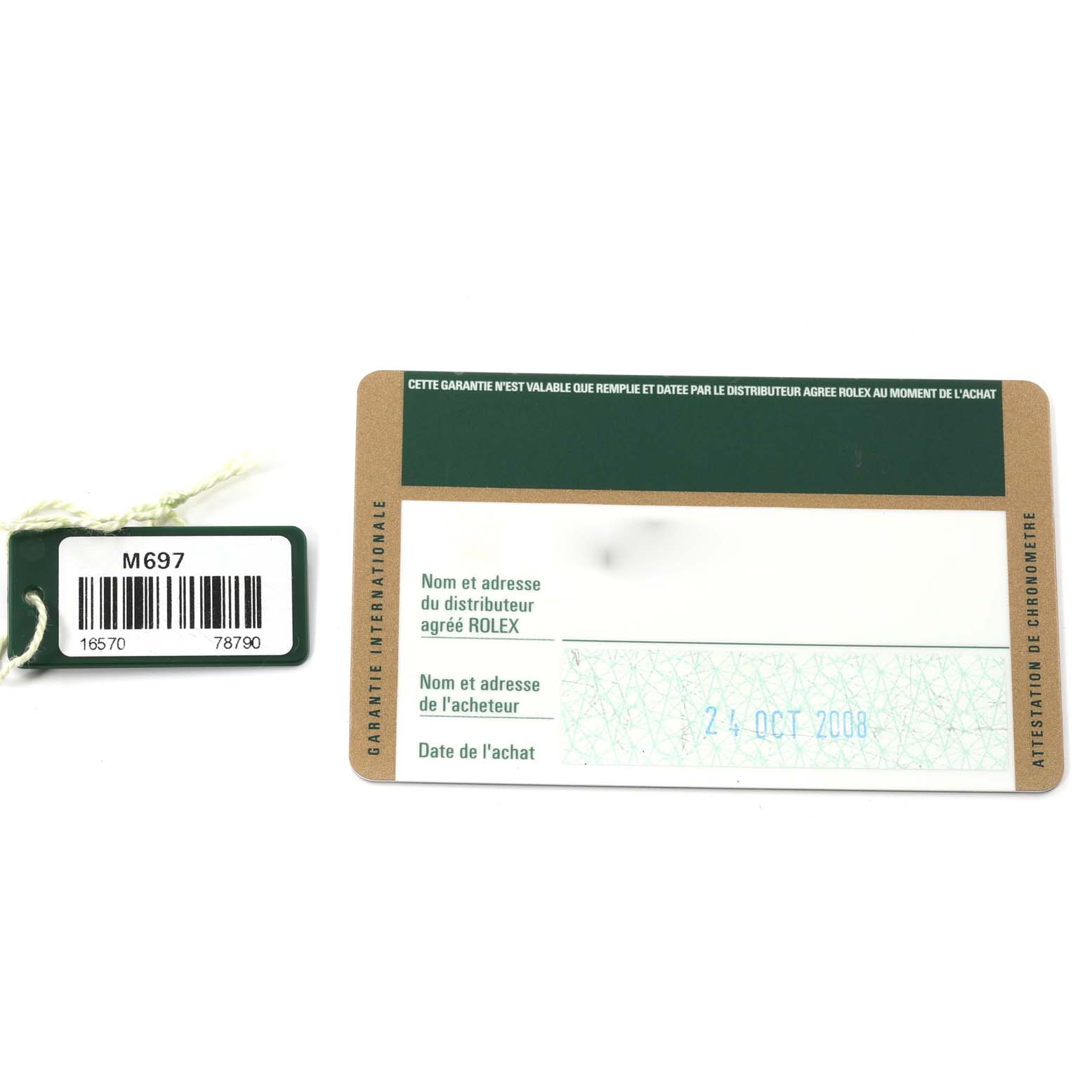 The image shows a warranty card and hang tag for a Rolex Explorer 16570 Men
s Stainless Steel White Dial 16570 Men
s Stainless Steel White Dial model, shot from a top-down angle.