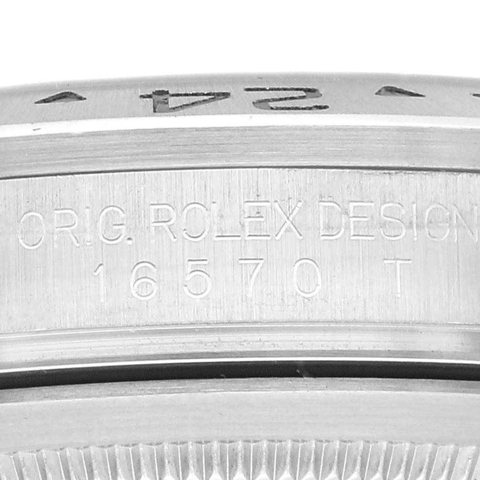 The image shows a close-up of the engraving on the case side of a Rolex Explorer 16570 Men
s Stainless Steel White Dial 16570 Men
s Stainless Steel White Dial model 16570.