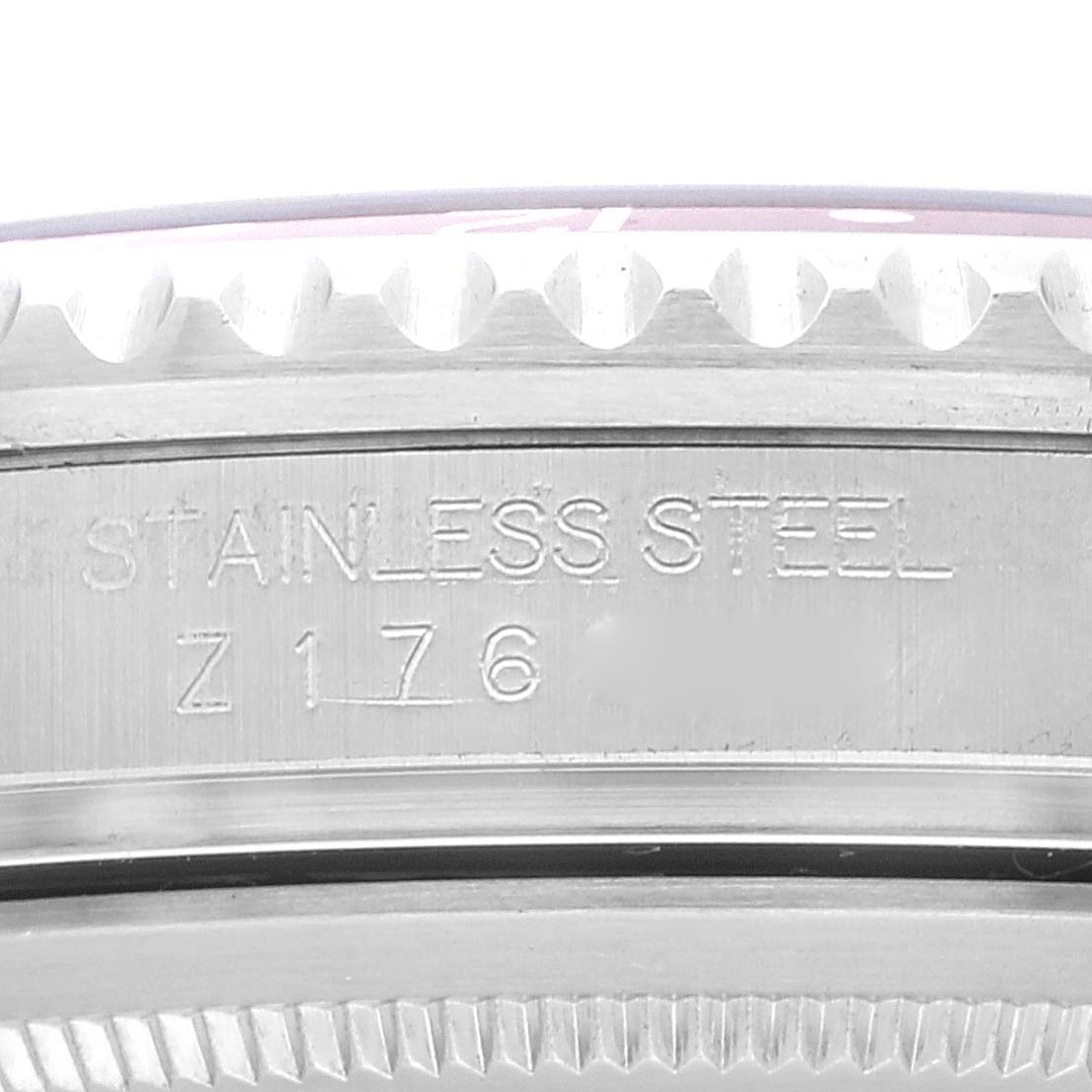 The image shows a close-up of the side of a Rolex GMT-Master 16710 Men's Stainless Steel Black Dial 16710 Men's Stainless Steel Black Dial watch, highlighting the brushed stainless steel case with engraved details.
