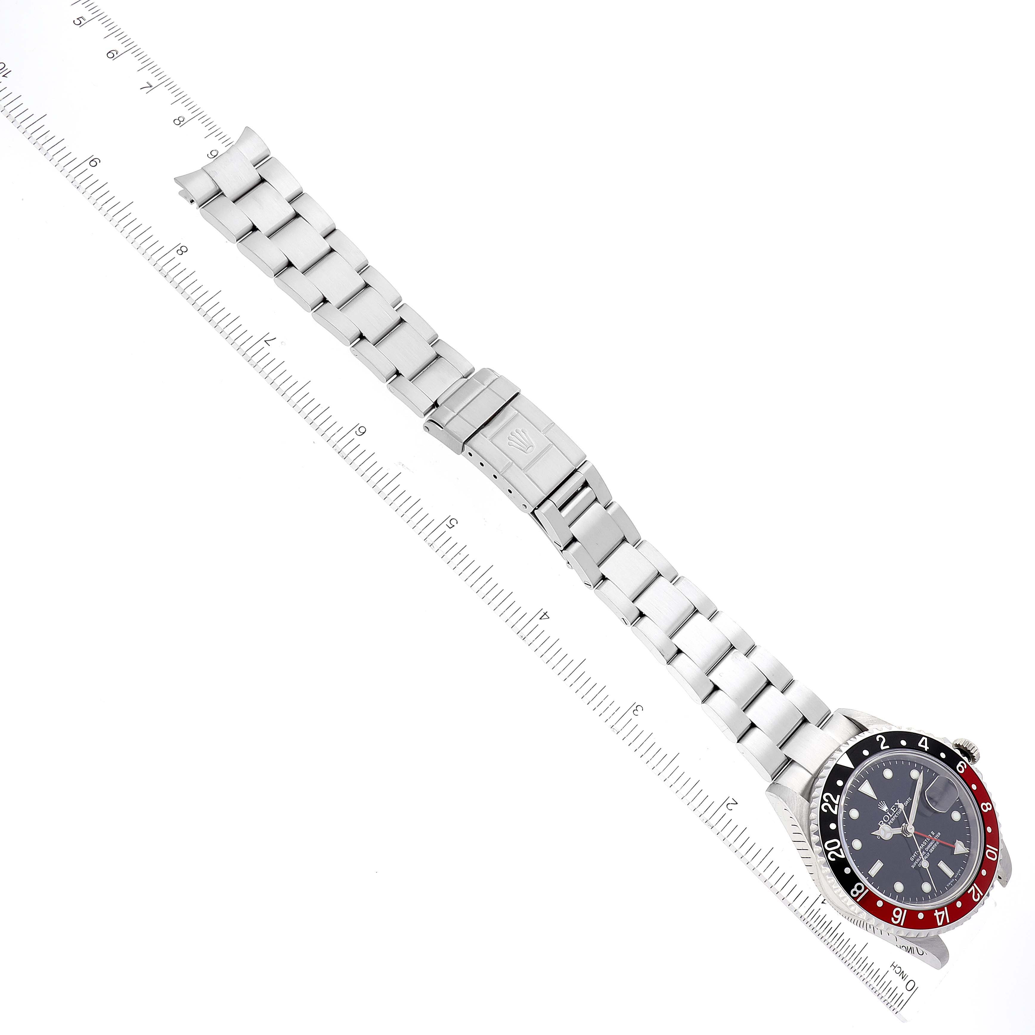 The image shows a top view of a Rolex GMT-Master 16710 Men's Stainless Steel Black Dial 16710 Men's Stainless Steel Black Dial watch including the face, bezel, and full bracelet with clasp.