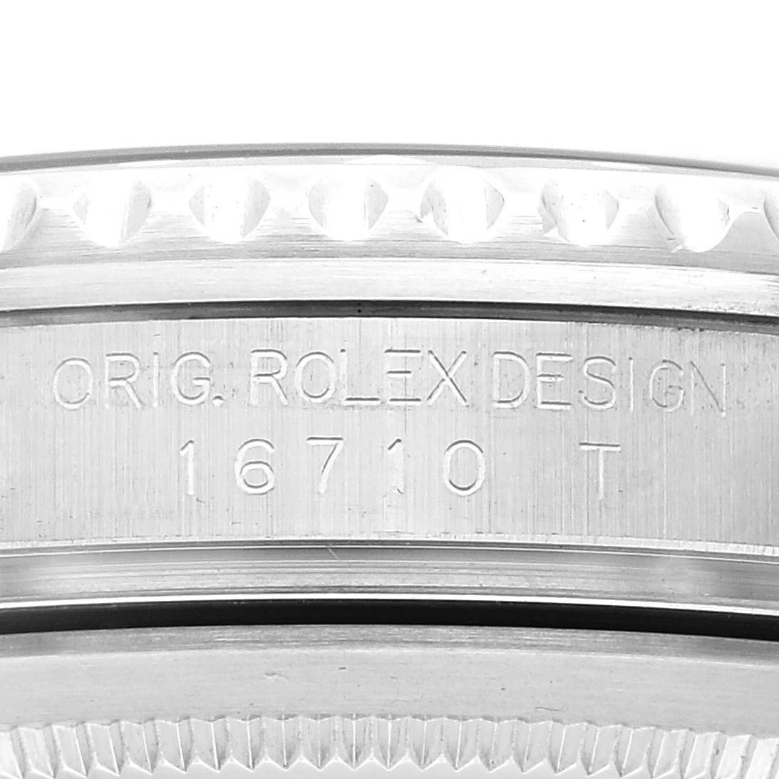 The image shows a close-up angle of the side of a Rolex GMT-Master 16710 Men's Stainless Steel Black Dial 16710 Men's Stainless Steel Black Dial watch, displaying the model number "16710T" and "ORIG. ROLEX DESIGN" engraving.