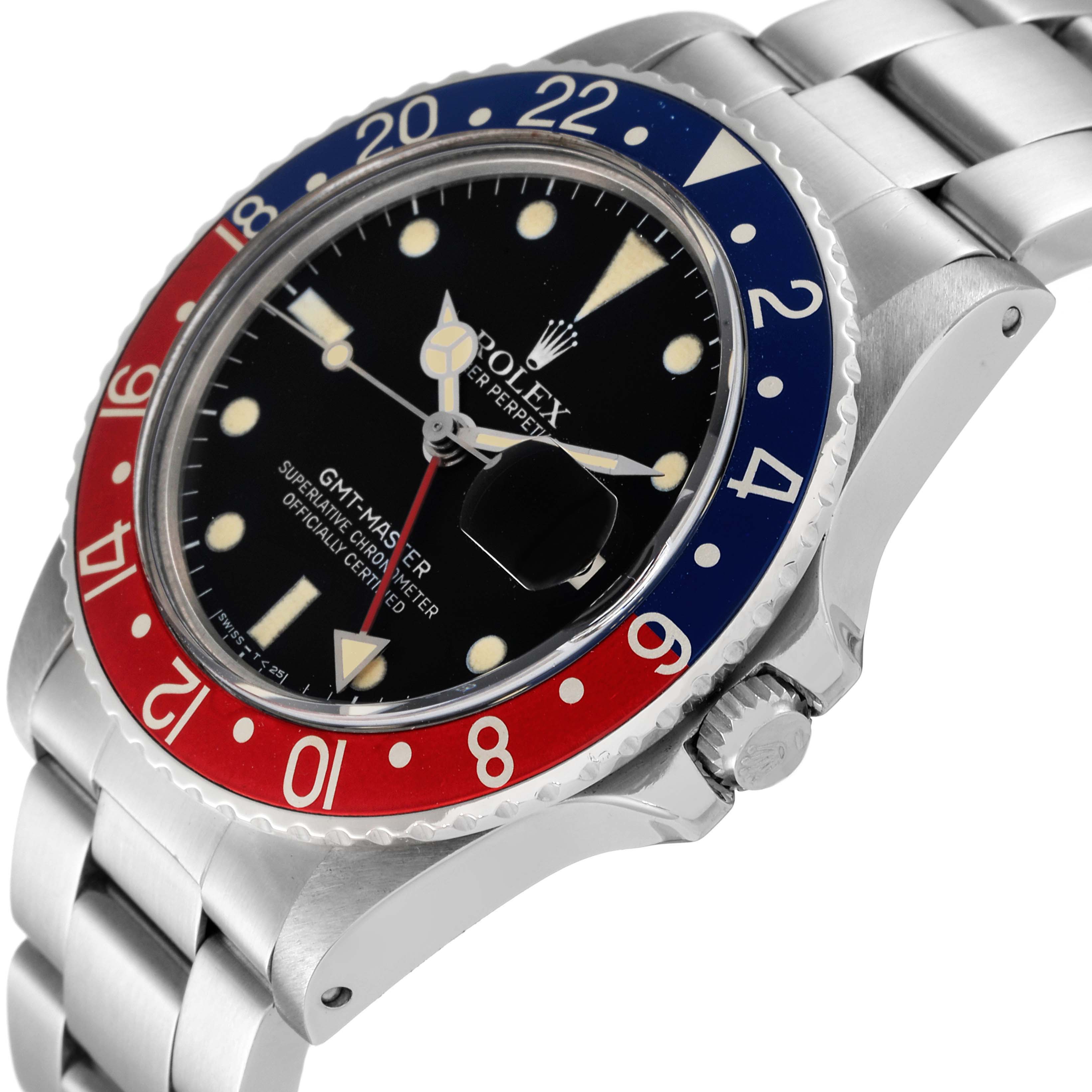This image shows the face, bezel, and stainless steel band of a Rolex GMT Master Vintage Collection watch at an angle.