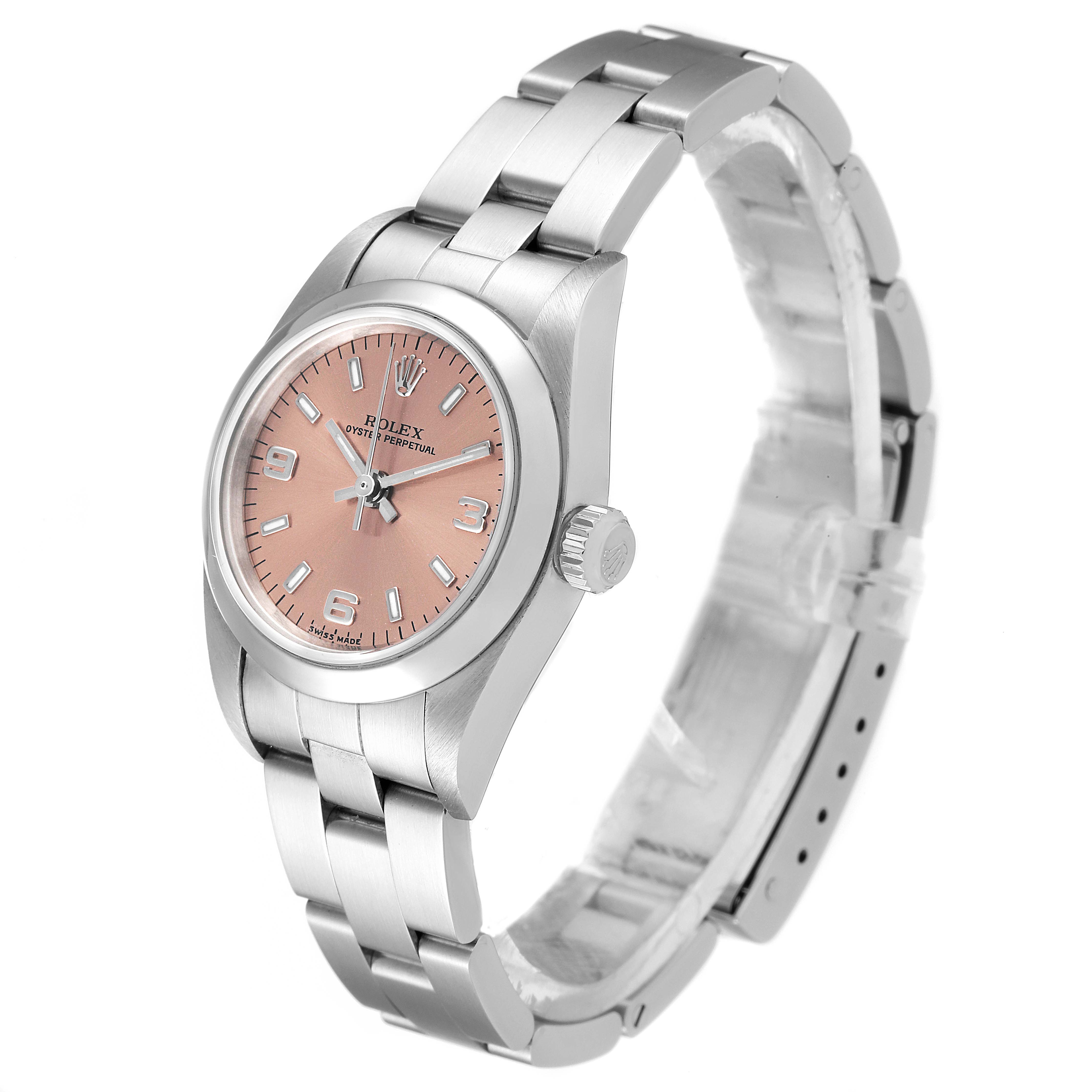 The Rolex Oyster Perpetual 76080 Women
s Stainless Steel Pink Dial 76080 Women
s Stainless Steel Pink Dial watch is shown from a three-quarter view, highlighting the dial, bracelet, crown, and clasp.
