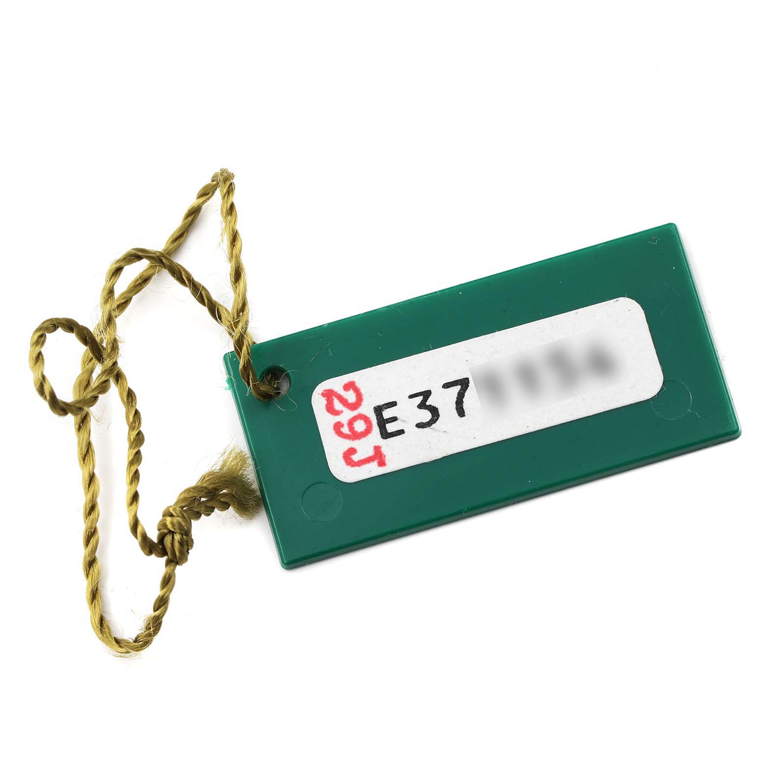 This image shows a green tag with a yellow string, likely an accessory tag for a Rolex Oyster Perpetual 76080 Women
s Stainless Steel Pink Dial 76080 Women
s Stainless Steel Pink Dial watch.