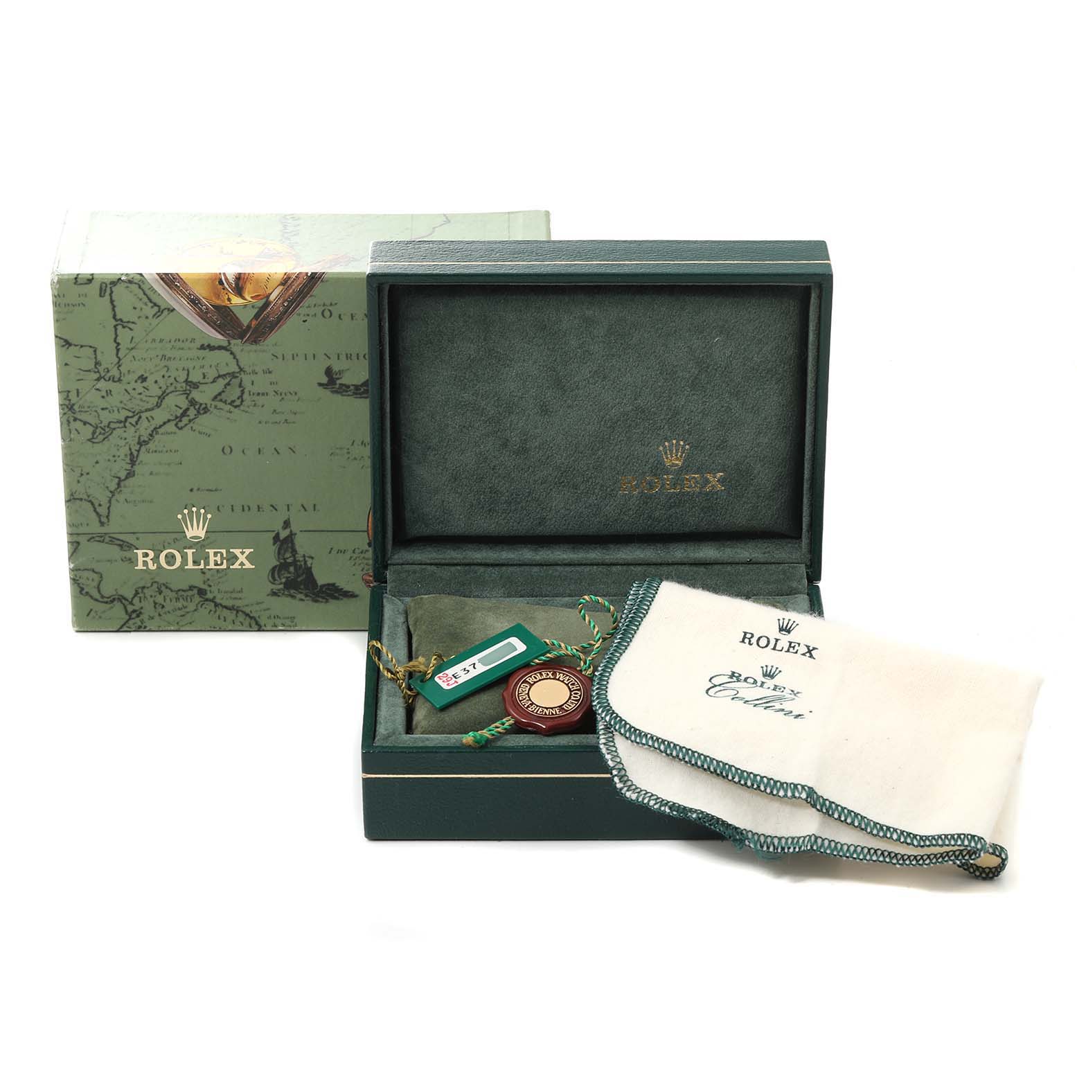 The angle shows the open box of a Rolex Oyster Perpetual 76080 Women
s Stainless Steel Pink Dial 76080 Women
s Stainless Steel Pink Dial watch, along with tags, and a cleaning cloth.