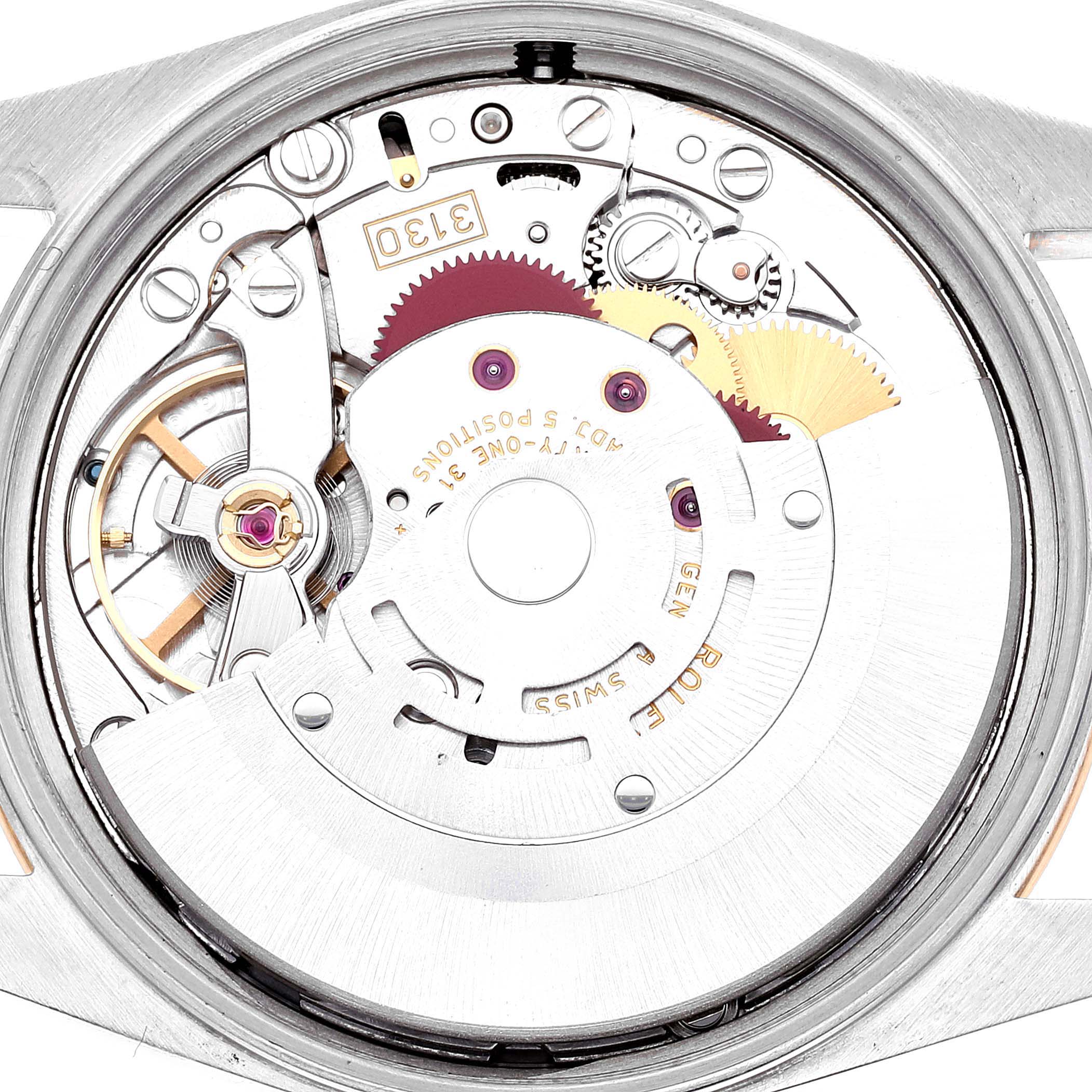 The image shows a close-up of the movement of a Rolex Oyster Perpetual 14203 Men's Steel and Gold (two tone) Grey Dial 14203 Men's Steel and Gold (two tone) Grey Dial watch, highlighting its intricate internal mechanisms.