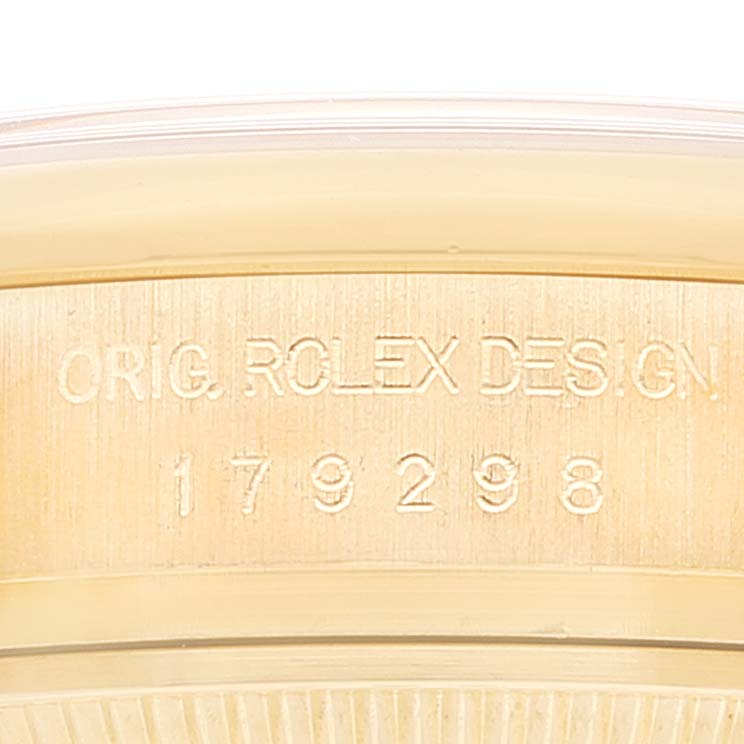 This close-up image shows the serial number engraving on the side of the case of a Rolex President 179298 Women
s Yellow Gold Champagne Dial 179298 Women
s Yellow Gold Champagne Dial model watch.