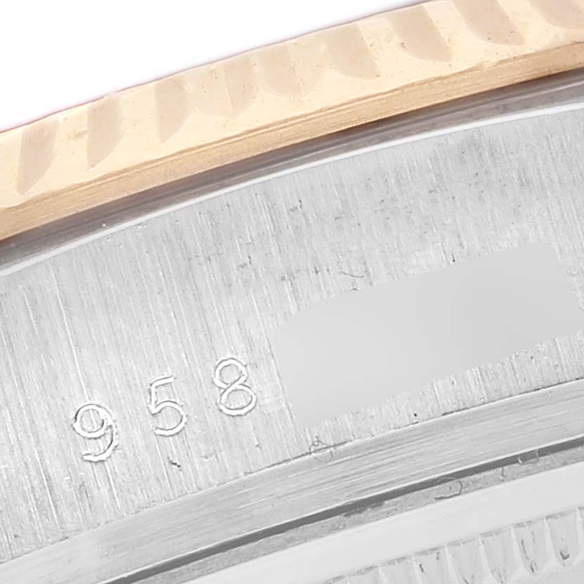 This image shows a close-up view of the case back and engraved serial number of a Rolex President 18039 Men's White Gold Champagne Dial 18039 Men's White Gold Champagne Dial model watch.