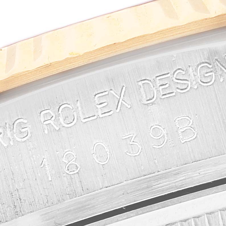 This close-up image shows the engraved details on the rim of a Rolex President 18039 Men's White Gold Champagne Dial 18039 Men's White Gold Champagne Dial model watch case.