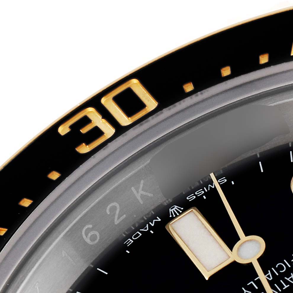 This image shows a close-up of the bezel and part of the dial of a Rolex Sea-Dweller 126603 Men
s Steel and Gold (two tone) Black Dial 126603 Men
s Steel and Gold (two tone) Black Dial watch.