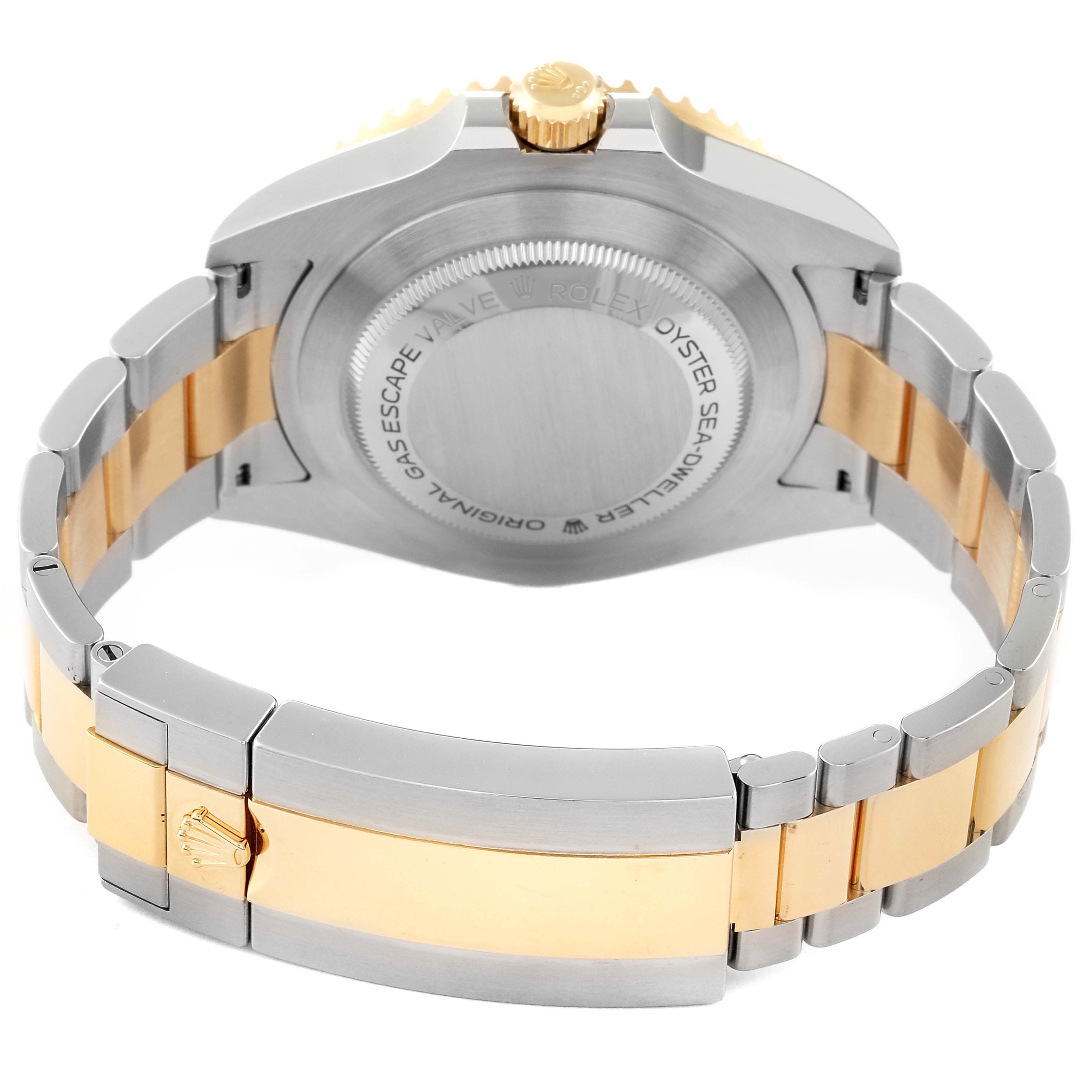 The image shows the back view and bracelet of a Rolex Sea-Dweller 126603 Men
s Steel and Gold (two tone) Black Dial 126603 Men
s Steel and Gold (two tone) Black Dial watch, highlighting the two-tone metal and clasp.
