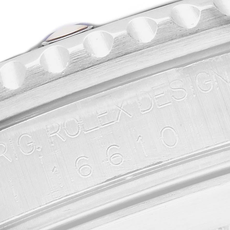 The image shows a close-up of the engraving on the side of the Rolex Submariner 16610 Men
s Stainless Steel Black Dial
s case.