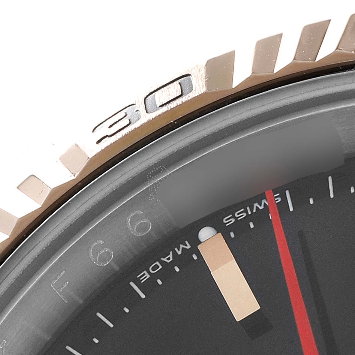 The image shows a close-up view of the bezel, part of the dial, and the hands of the Rolex Turn-o-Graph 116261 Men's Steel and Gold (two tone) Black Dial 116261 Men's Steel and Gold (two tone) Black Dial watch.