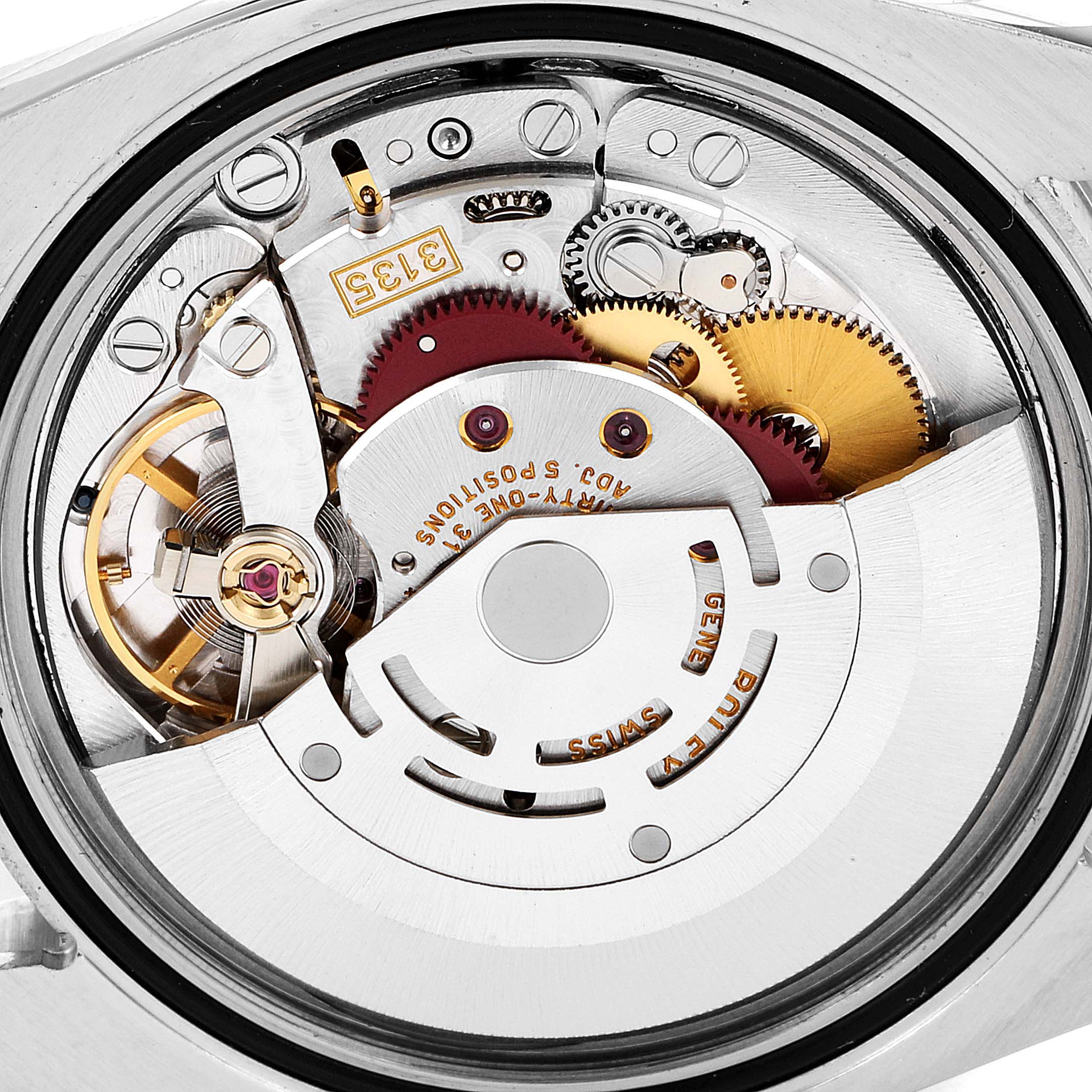 This image shows a close-up view of the movement mechanism inside a Rolex Turn-o-Graph 116261 Men's Steel and Gold (two tone) Black Dial 116261 Men's Steel and Gold (two tone) Black Dial watch.