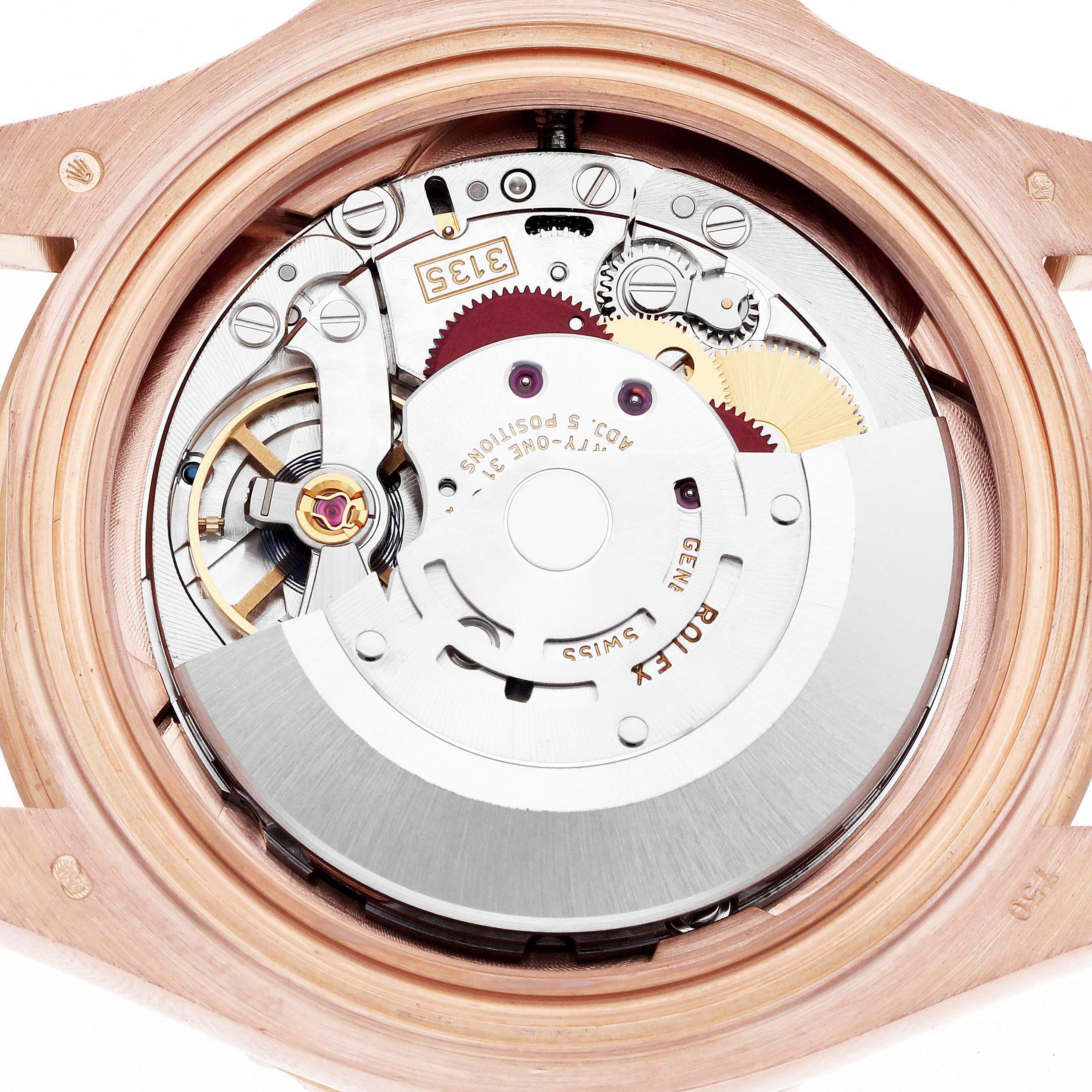 The image shows the back view of the Rolex Yacht-Master 116655 Men
s Rose Gold Black Dial, highlighting its intricate movement and internal components.