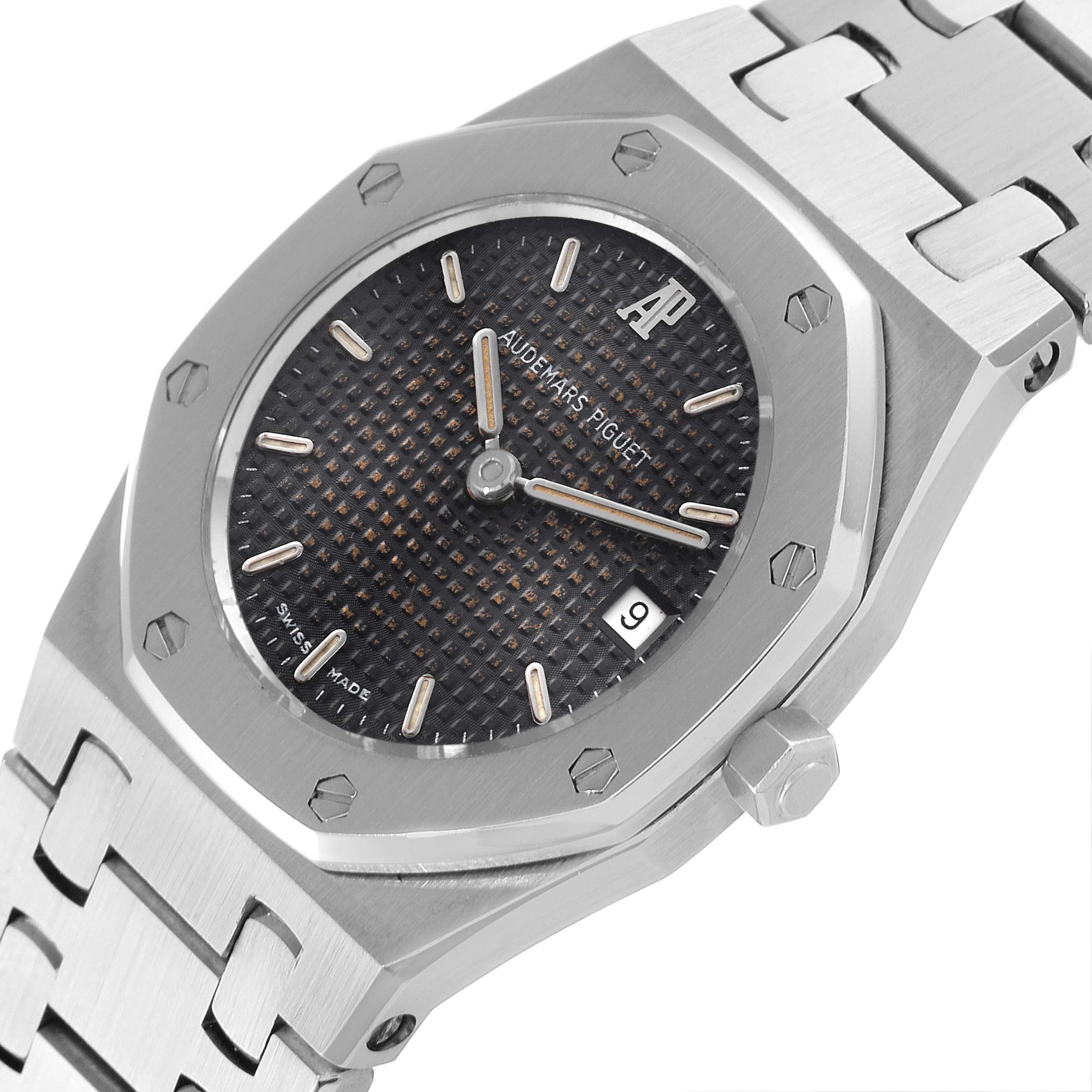 The image shows a close-up of the face, bezel, and bracelet of a Royal Oak watch by Audemars Piguet at an angled view.