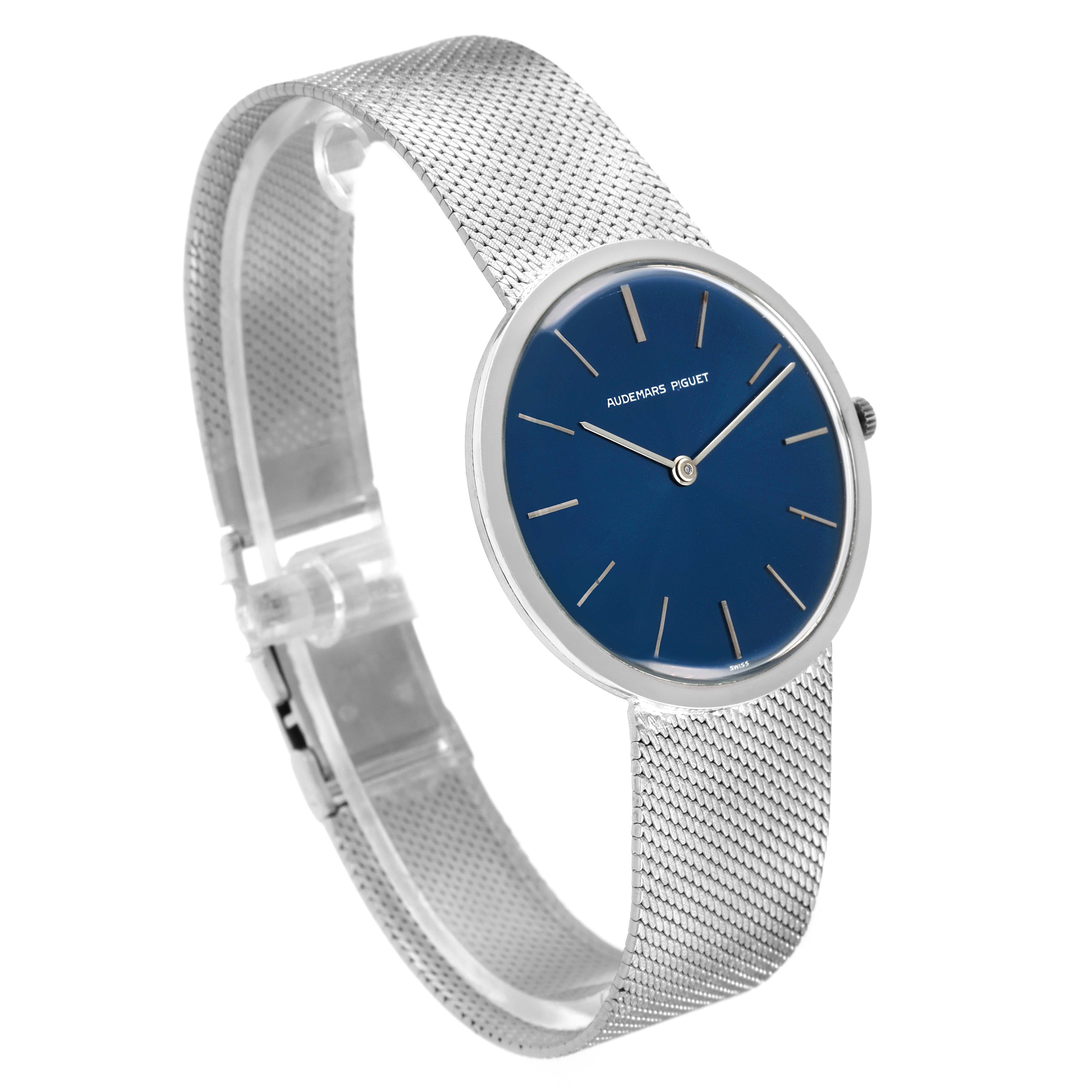 The image shows a side view of the Vintage Audemars Piguet watch, highlighting its blue dial and metallic mesh bracelet.