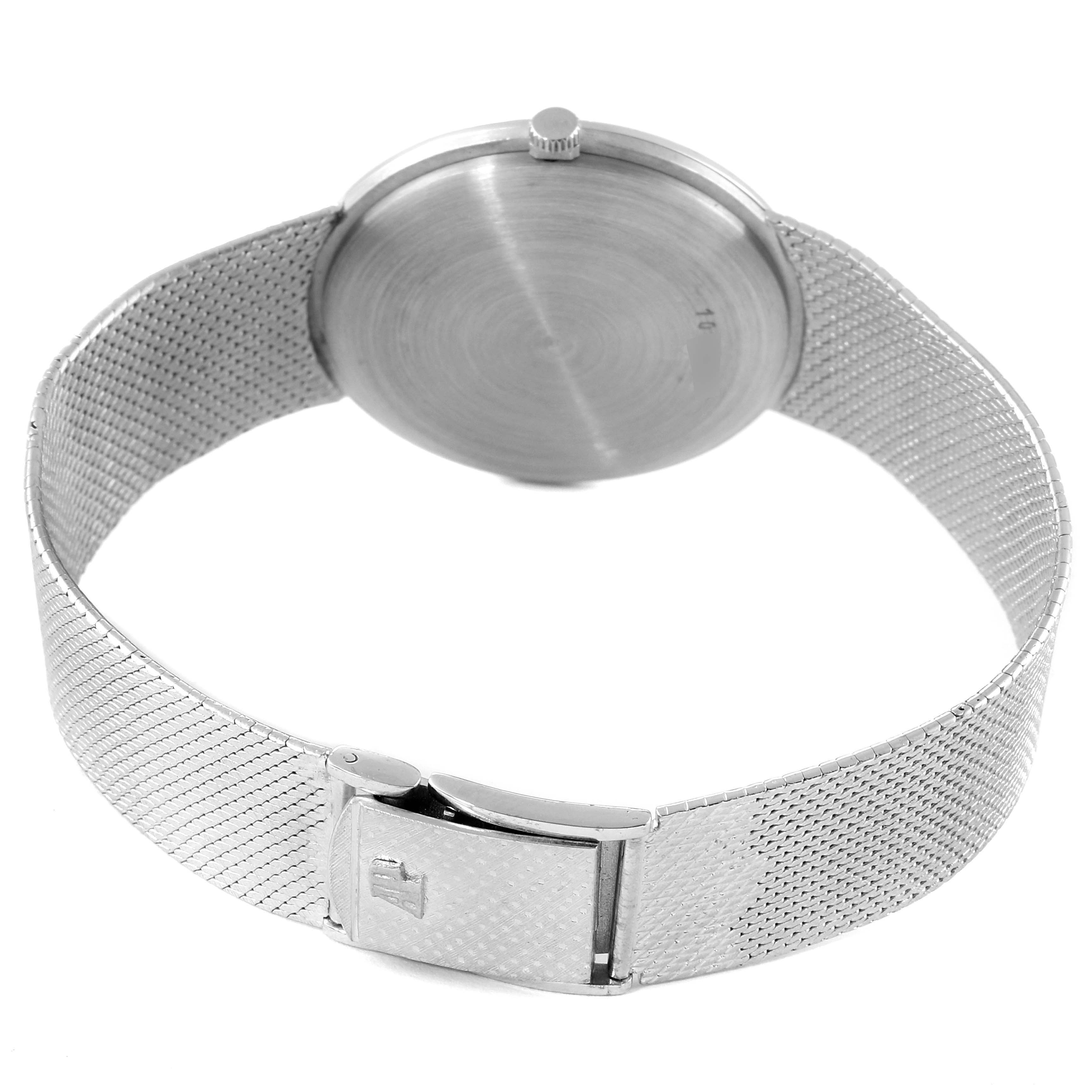 The image shows the back and clasp of a Vintage Audemars Piguet watch, with a stainless steel mesh bracelet.