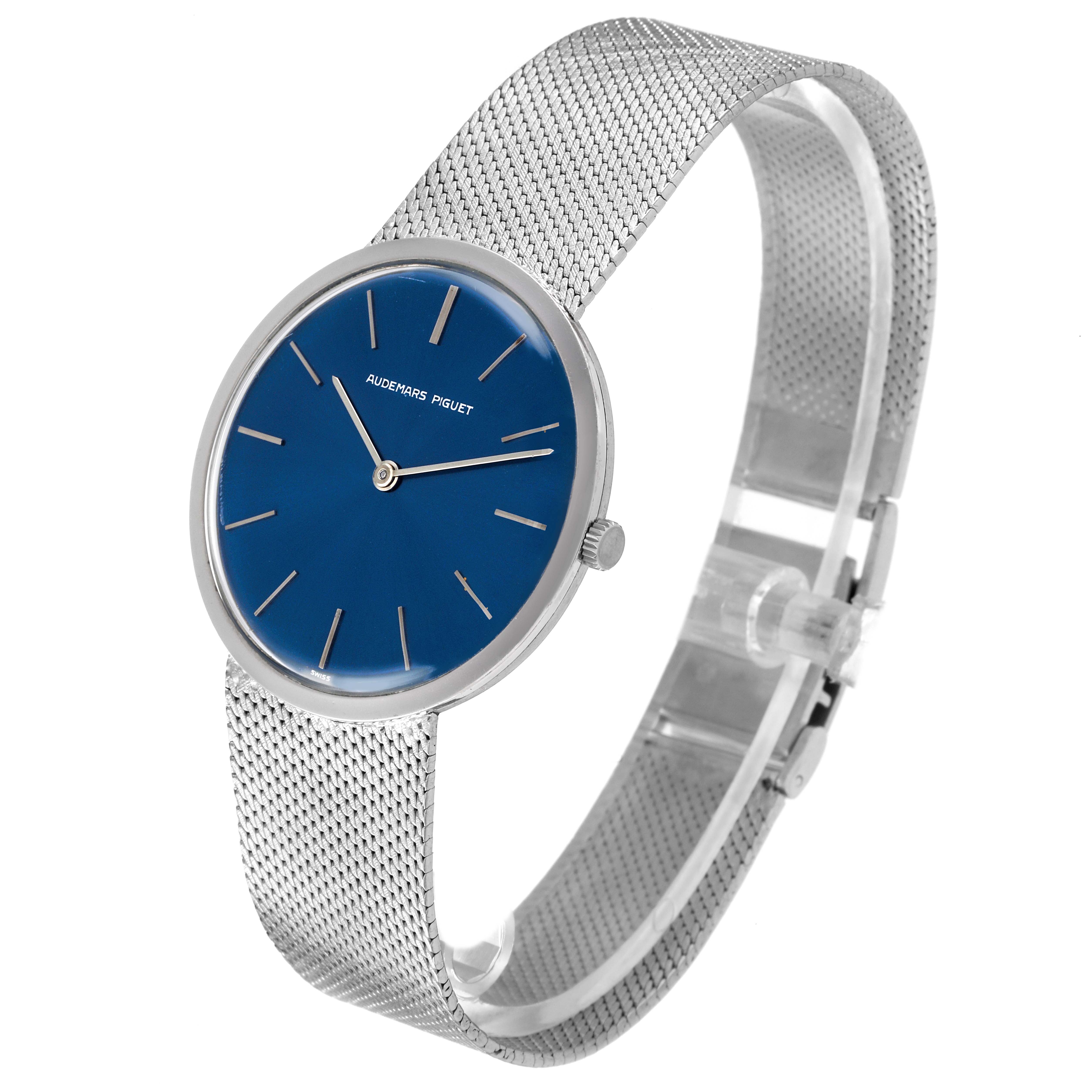 The Audemars Piguet Vintage Men's White Gold Blue Dial Men's White Gold Blue Dial watch is shown at a three-quarter angle, highlighting the mesh strap, blue dial, and crown.