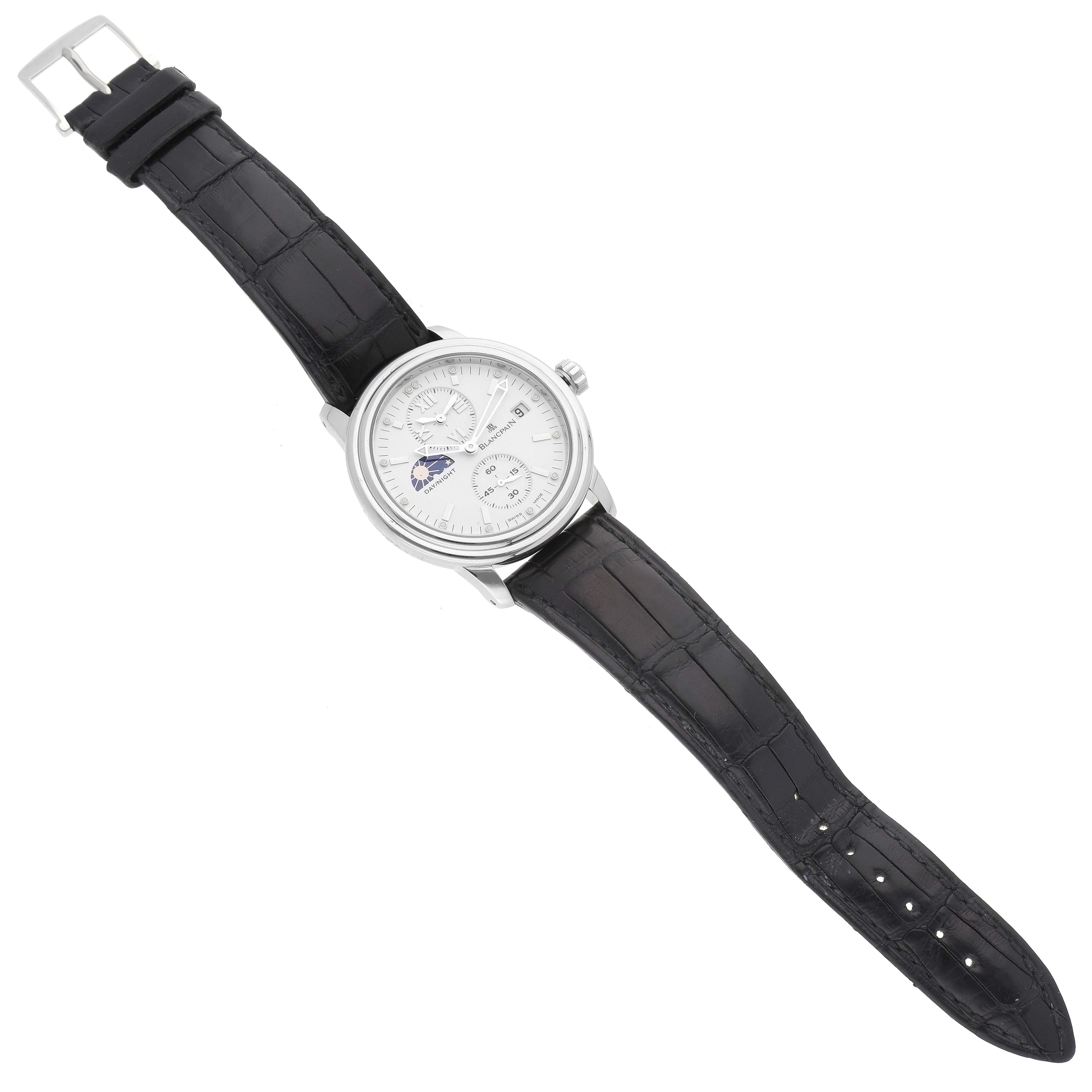 The Blancpain Villeret 2160-1127-53 Men's Stainless Steel White Dial 2160-1127-53 Men's Stainless Steel White Dial watch is shown from a top-down angle, highlighting its face, black leather strap, silver case, and crown.