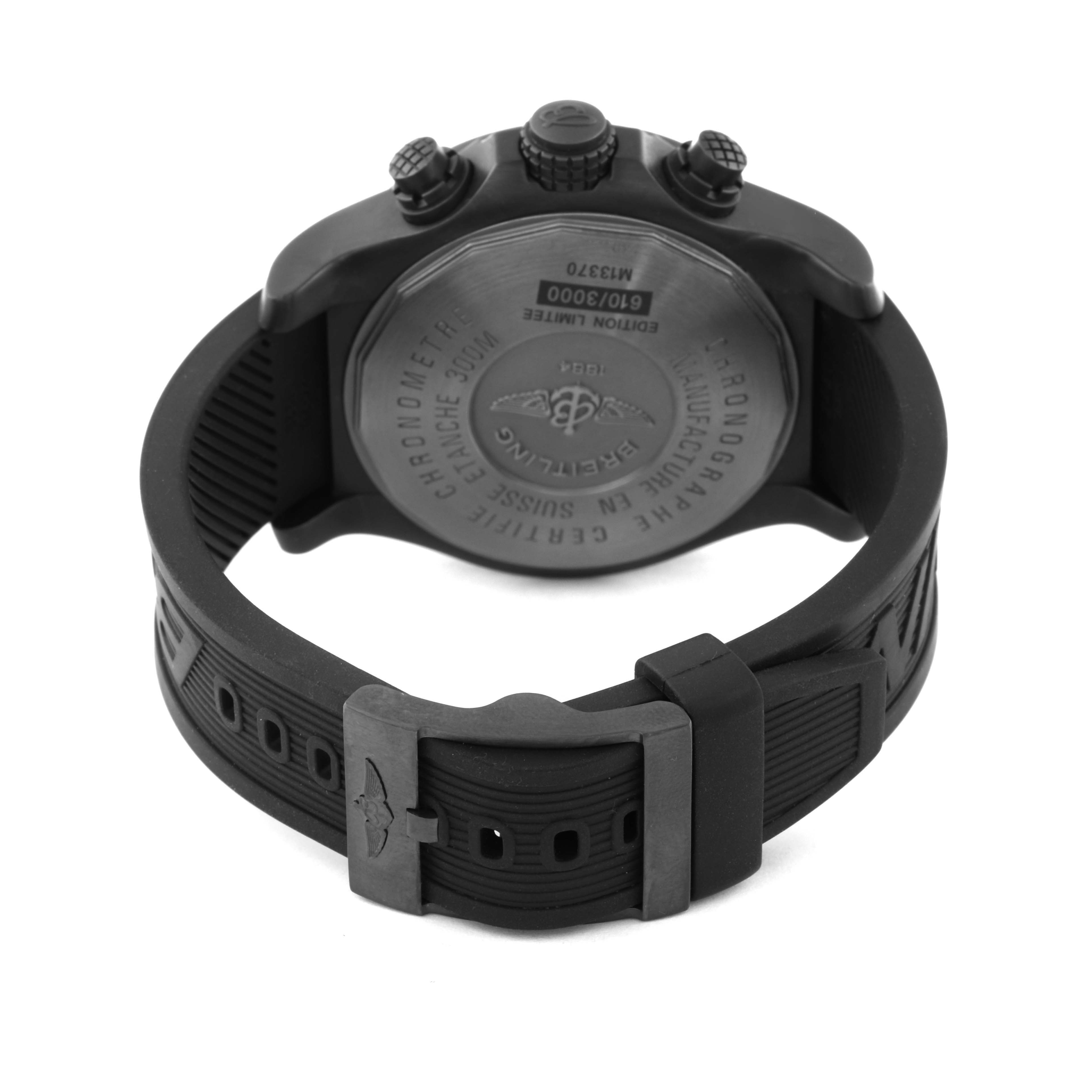 The image shows the back view of a Breitling Limited Series watch, highlighting its case back and black rubber strap with a clasp.