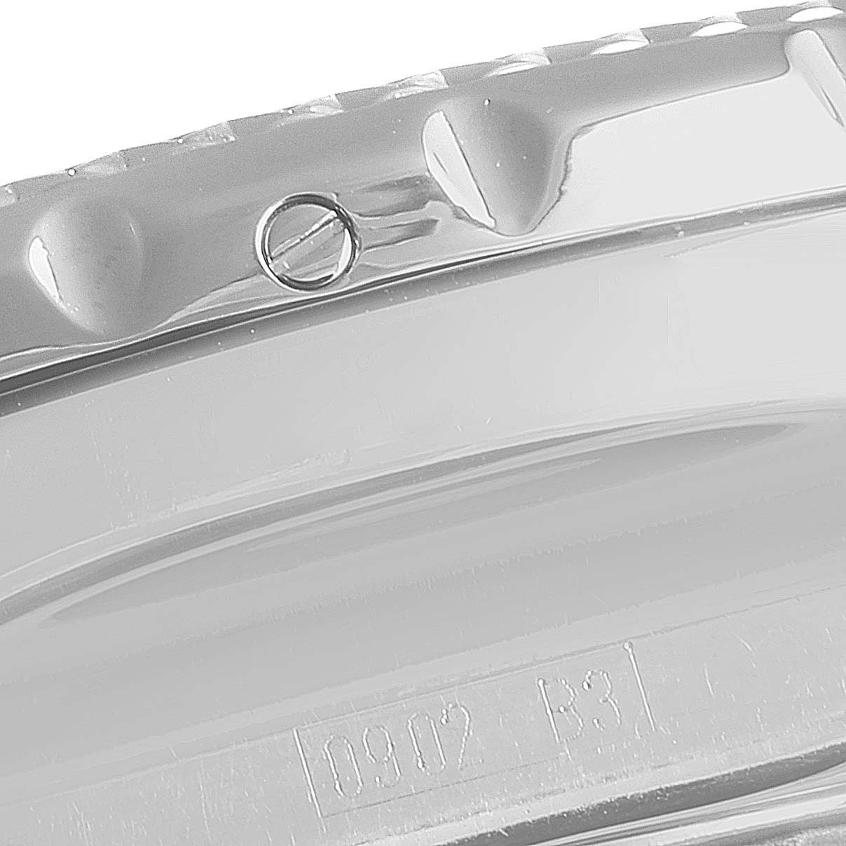 The image shows a close-up of the bezel and part of the case back from the Bentley model by Breitling.