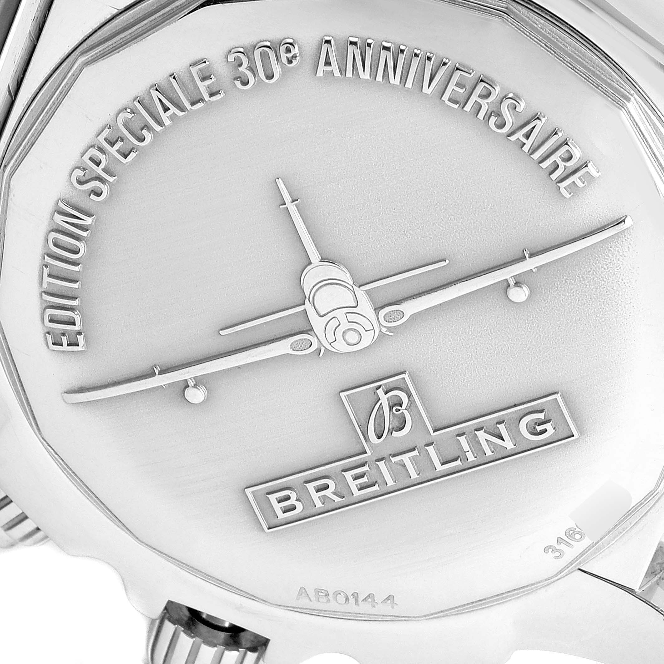 The image shows the back case of a Breitling Chronomat AB0141 Men's Stainless Steel Black Dial AB0141 Men's Stainless Steel Black Dial watch featuring an engraved 30th-anniversary edition design.