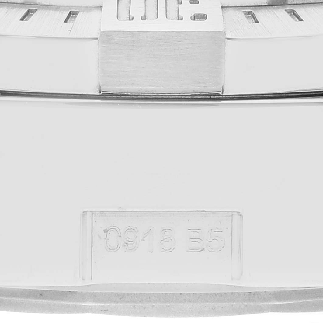 The image shows a close-up of the case back of the Breitling Avenger A13381 Men's Stainless Steel Blue Dial A13381 Men's Stainless Steel Blue Dial model watch, focusing on the serial number.