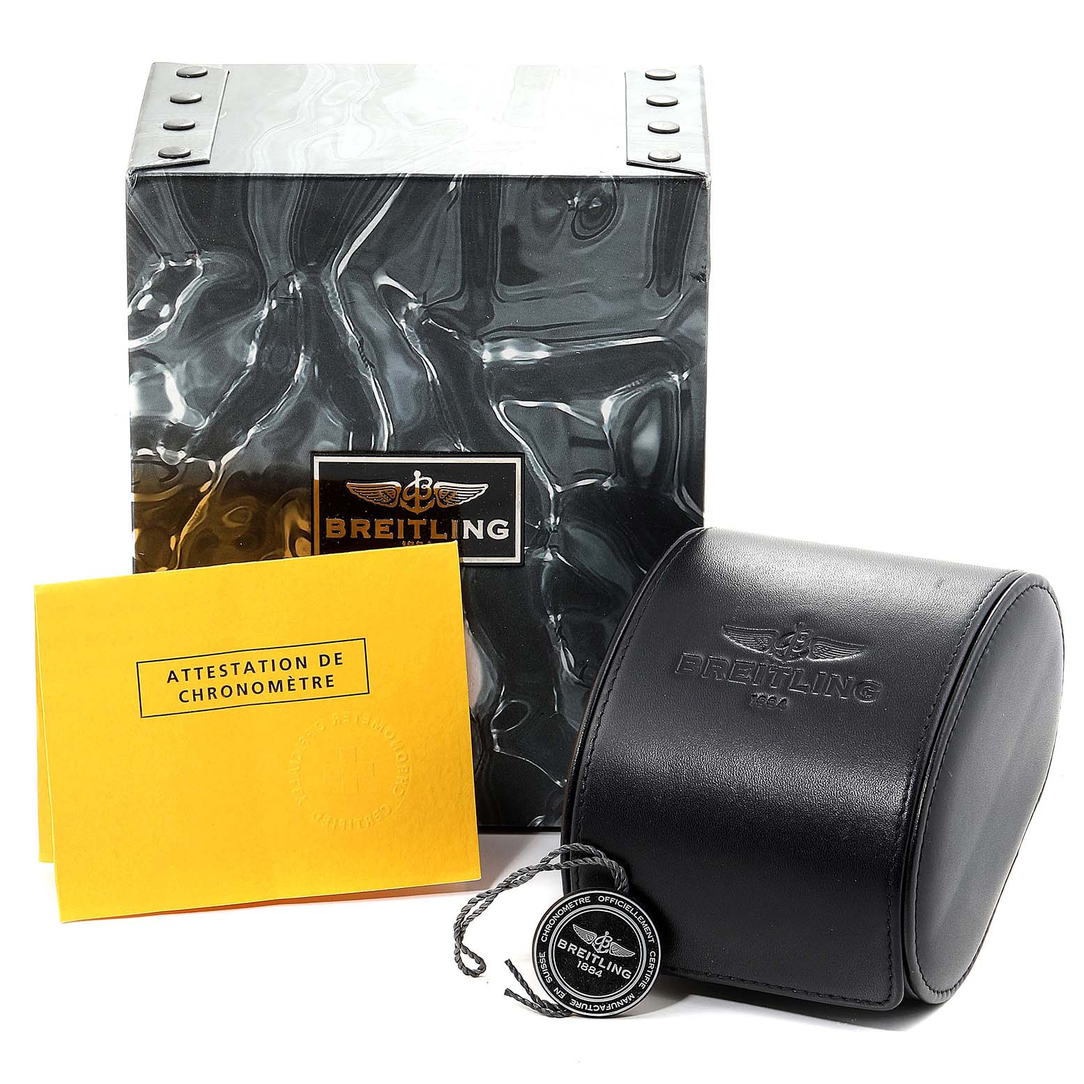The image shows the packaging and accessories of a Breitling Superocean A17320 Men
s Stainless Steel Black Dial A17320 Men
s Stainless Steel Black Dial, including the outer box, watch case, manual, and tag.