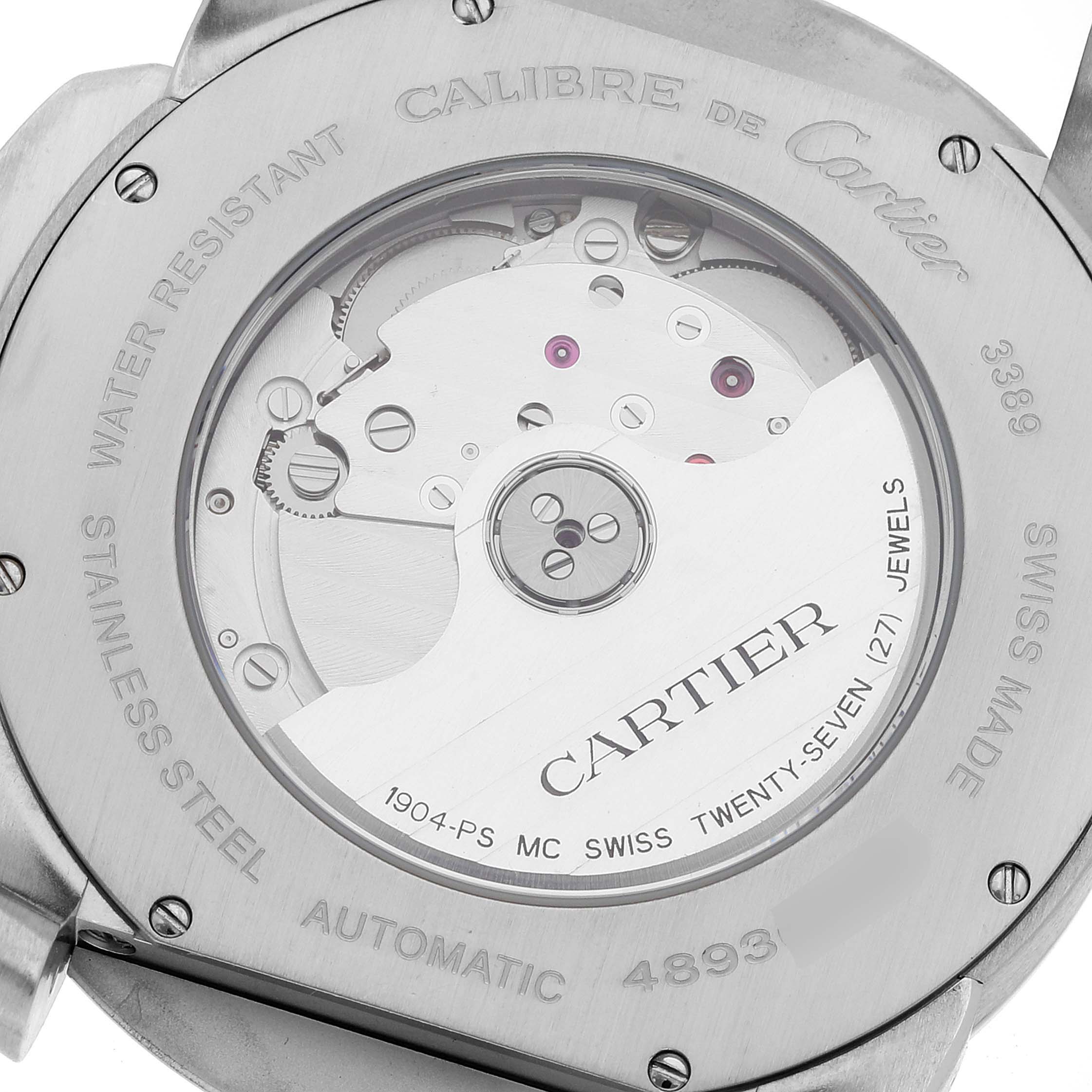 The image shows the back case and movement mechanism of a Calibre de Cartier watch by Cartier.