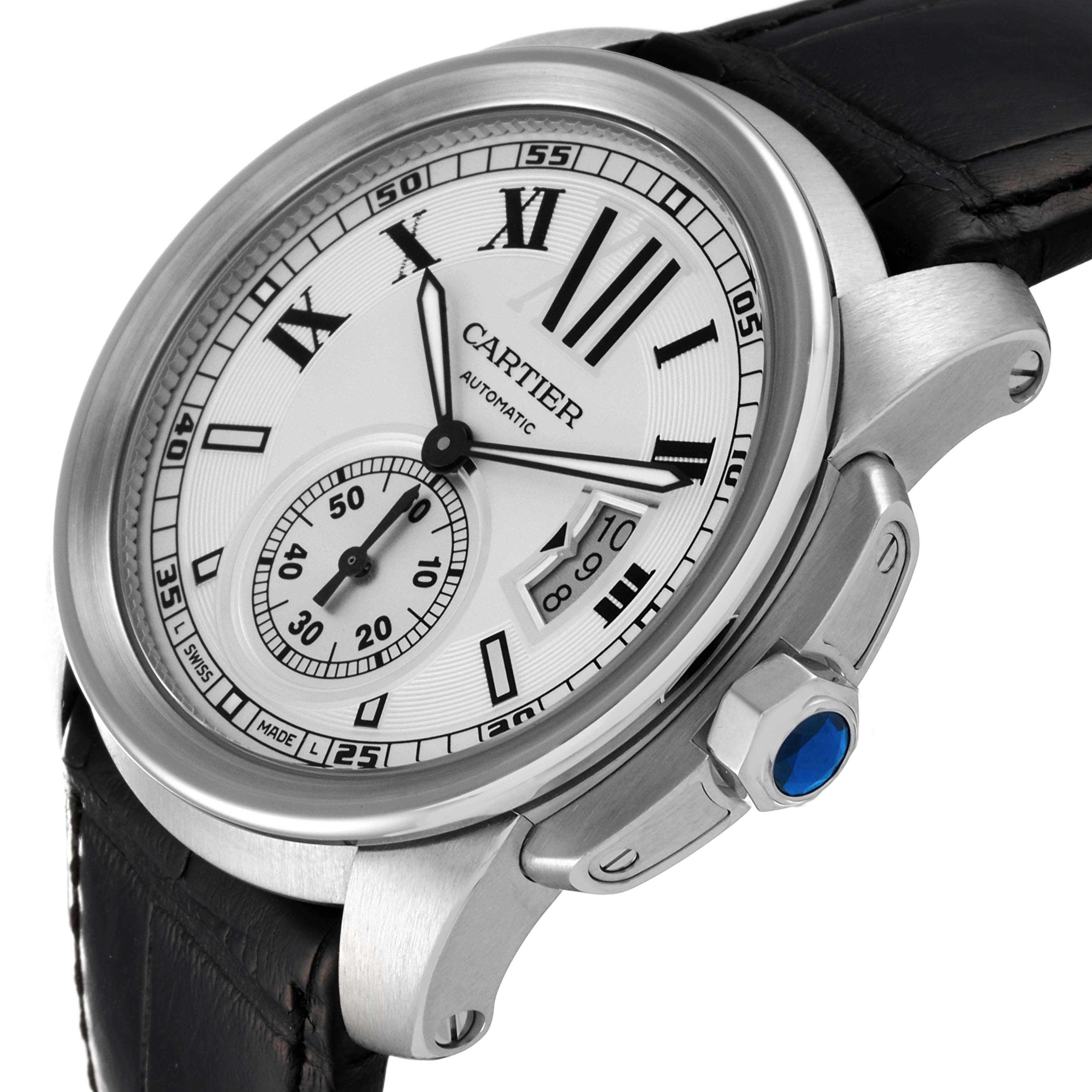 This image shows a close-up angled view of the Calibre de Cartier watch by Cartier, highlighting the dial, bezel, and crown.