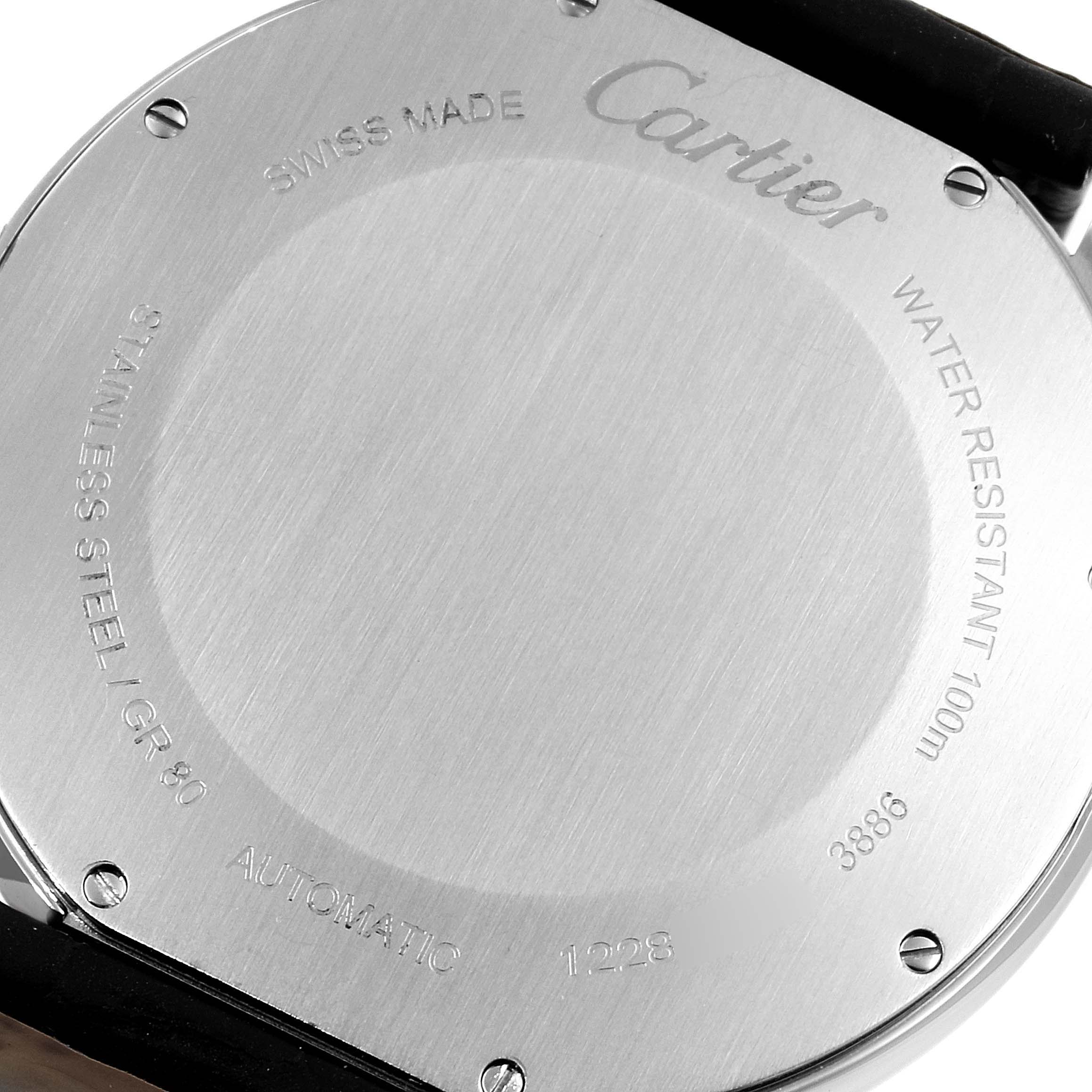 This image shows the back of a Cartier Ronde W2RN0005 Men's Steel and Gold (two tone) Grey Dial W2RN0005 Men's Steel and Gold (two tone) Grey Dial watch, displaying engravings and screws.