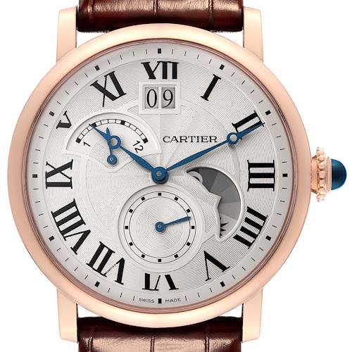 The image shows a front view of a Cartier Rotonde watch, featuring a brown leather strap, a rose gold case, Roman numeral markers, and blue hands.