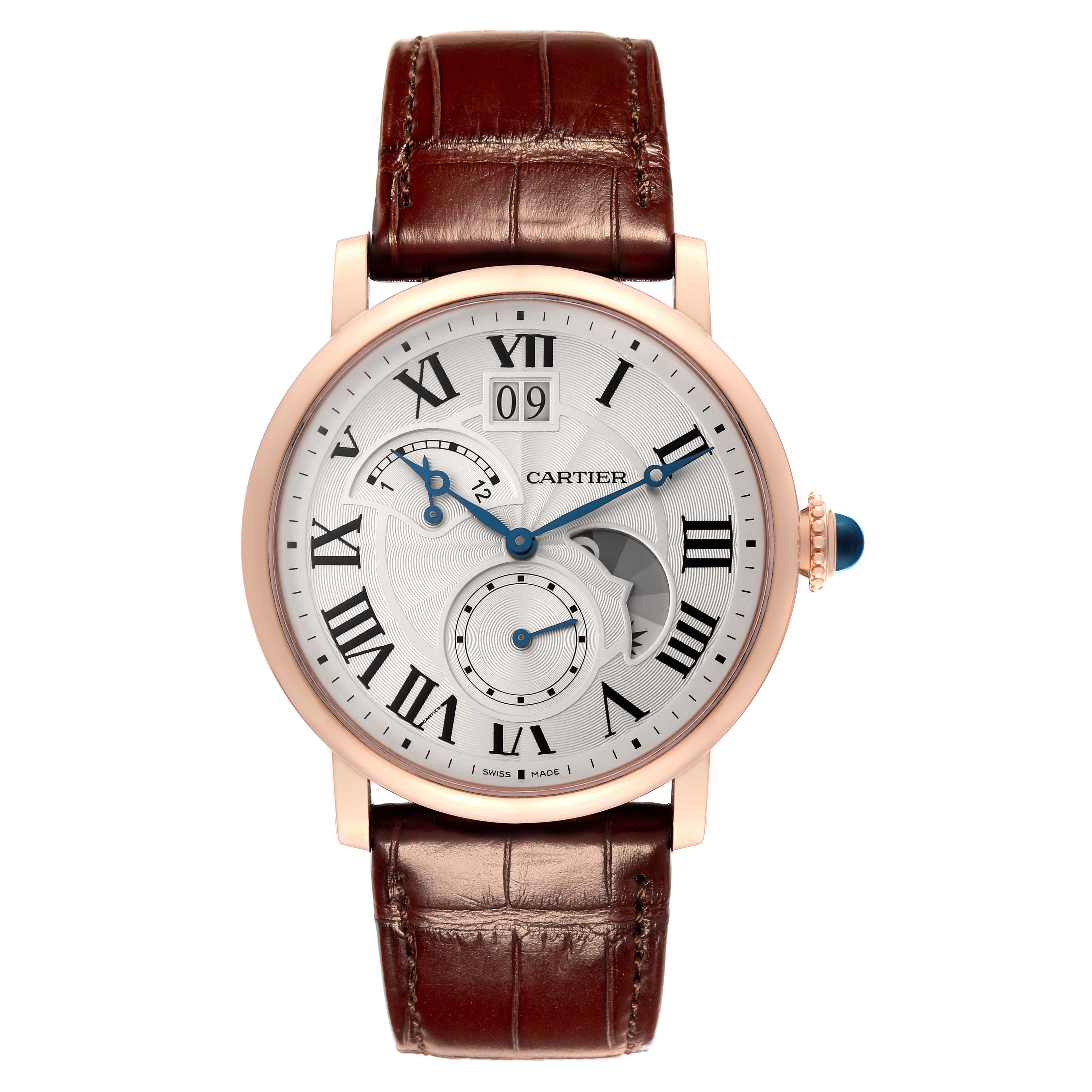 The image shows a front view of a Rotonde de Cartier watch, showcasing its dial, brown leather strap, and crown.