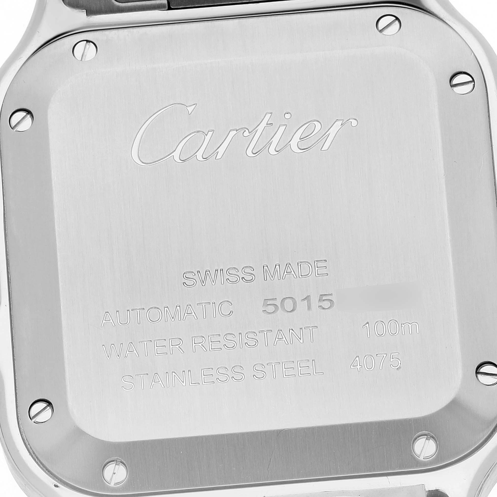 The image shows the back case of a Cartier Santos W4SA0005 Men
s Stainless Steel Silver Dial W4SA0005 Men
s Stainless Steel Silver Dial watch with engraved details.